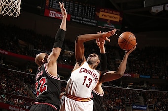 CLEVELAND, OH - JANUARY 19:  Tristan Thompson #13 of the Cleveland Cavaliers shoots against Taj Gibson #22 of the Chicago Bulls on January 19, 2015 at The Quicken Loans Arena in Cleveland, Ohio. NOTE TO USER: User expressly acknowledges and agrees that, b