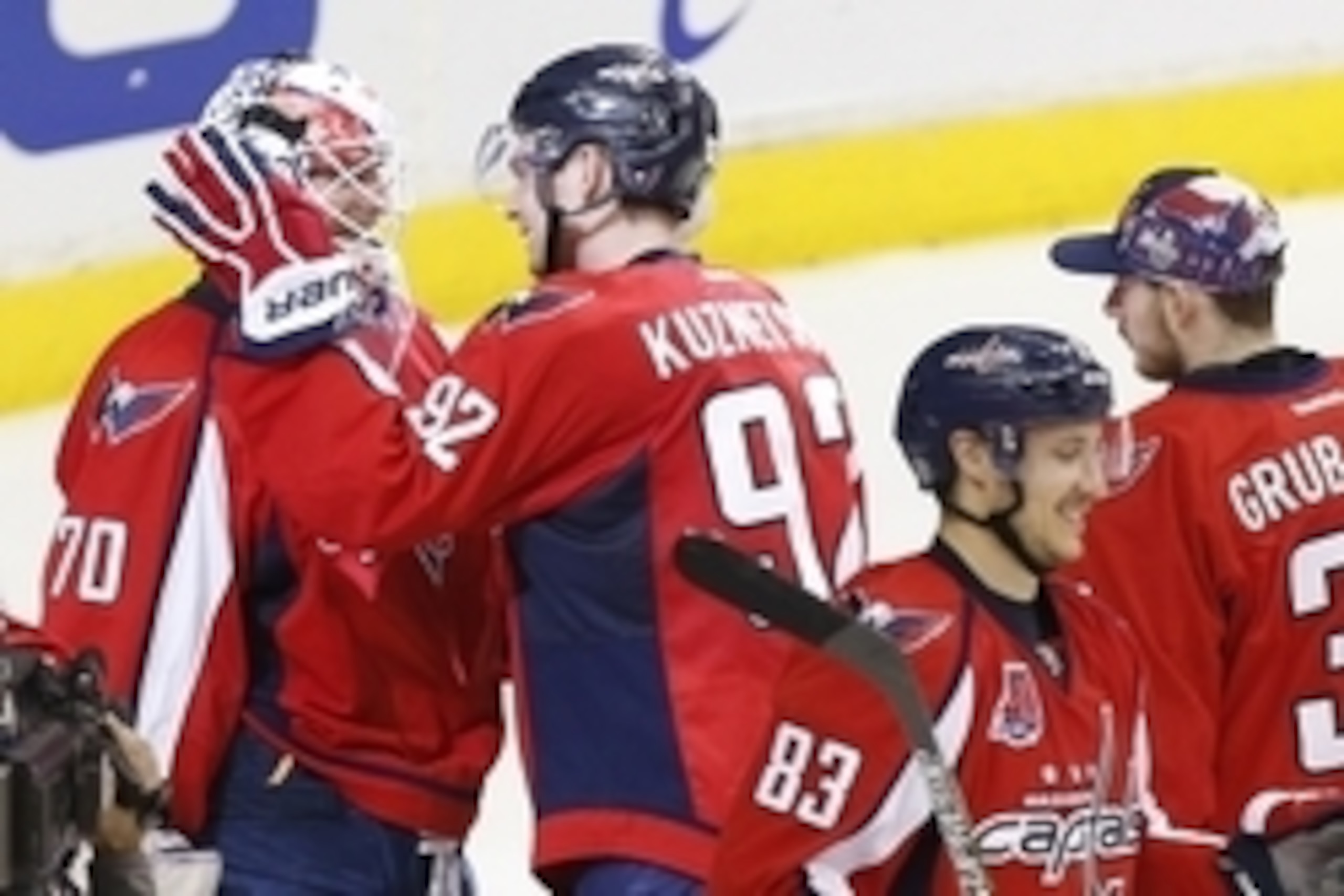 Apr 23, 2015; Washington, DC, USA; Washington Capitals center Evgeny Kuznetsov (92) celebrates with goalie Braden Holtby (70) after their game against the New York Islanders in game five of the first round of the 2015 Stanley Cup Playoffs at Verizon Cente Apr 23, 2015; Washington, DC, USA; Washington Capitals center Evgeny Kuznetsov (92) celebrates with goalie Braden Holtby (70) after their game against the New York Islanders in game five of the first round of the 2015 Stanley Cup Playoffs at Verizon Cente