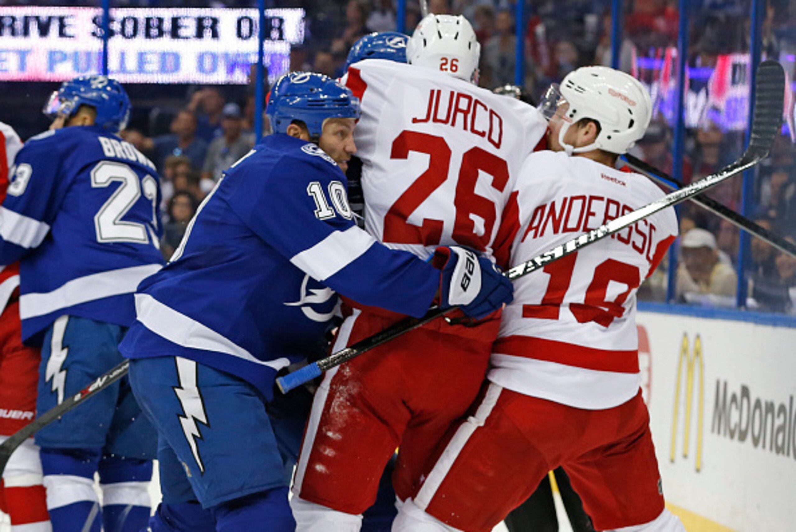 TAMPA, FL - APRIL 25: Brenden Morrow #10 of the Tampa Bay Lightning battles against Joakim Andersson #18 and Tomas Jurco #26 of the Detroit Red Wings during the first period in Game Five of the Eastern Conference Quarterfinals during the 2015 NHL Stanley TAMPA, FL - APRIL 25: Brenden Morrow #10 of the Tampa Bay Lightning battles against Joakim Andersson #18 and Tomas Jurco #26 of the Detroit Red Wings during the first period in Game Five of the Eastern Conference Quarterfinals during the 2015 NHL Stanley