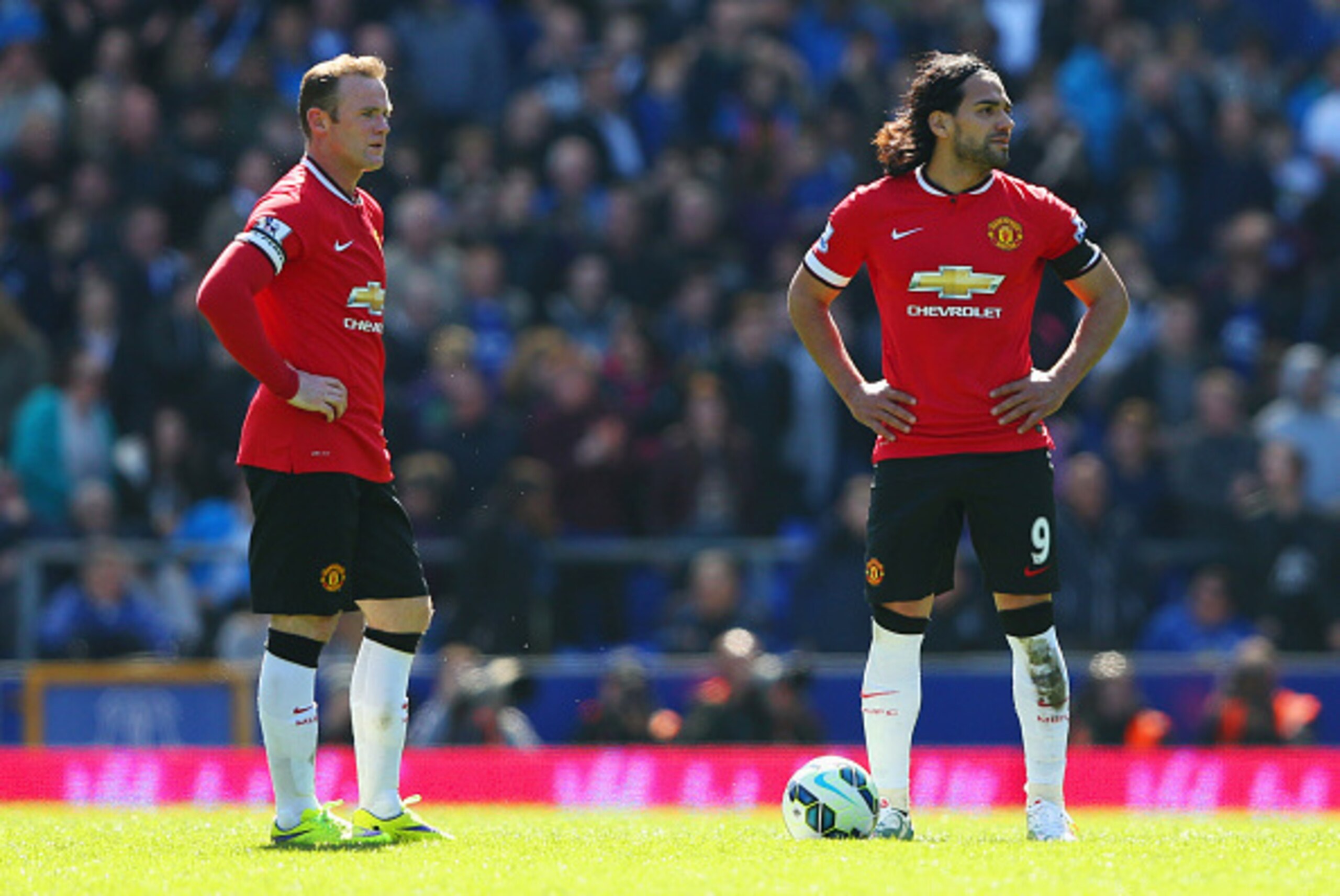 LIVERPOOL, ENGLAND - APRIL 26:  Radamel Falcao Garcia (9) and Wayne Rooney of Manchester United look dejected as Kevin Mirallas of Everton scores their third goal during the Barclays Premier League match between Everton and Manchester United at Goodison P