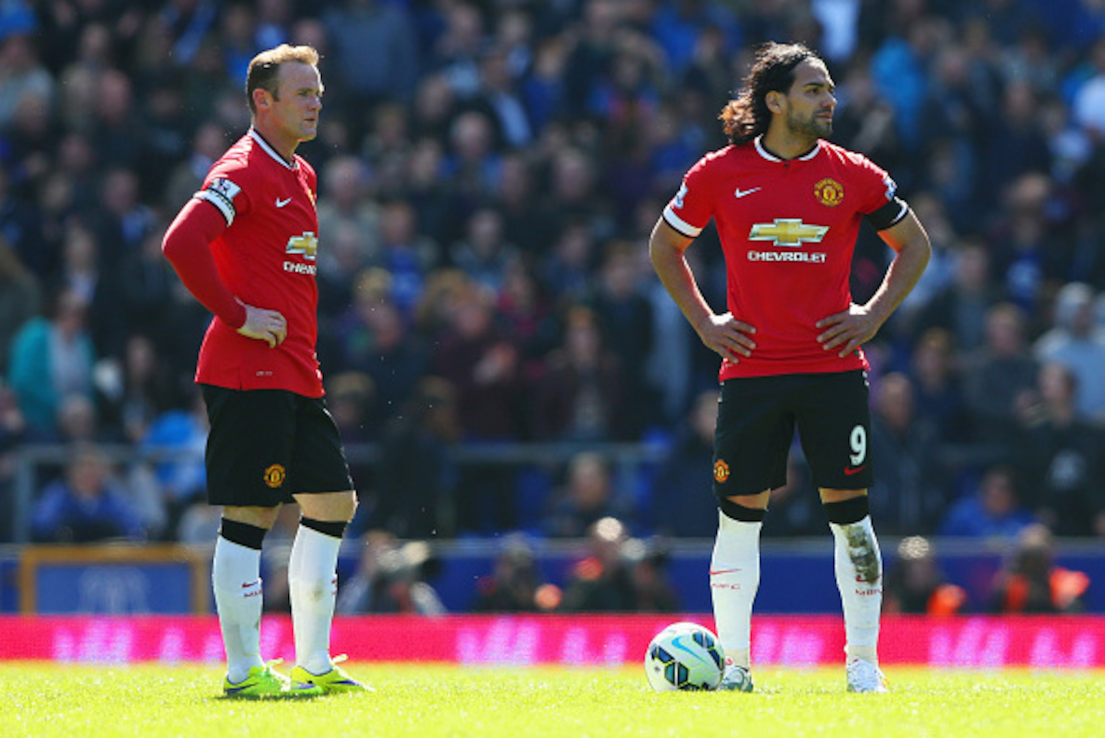 LIVERPOOL, ENGLAND - APRIL 26: Radamel Falcao Garcia (9) and Wayne Rooney of Manchester United look dejected as Kevin Mirallas of Everton scores their third goal during the Barclays Premier League match between Everton and Manchester United at Goodison P LIVERPOOL, ENGLAND - APRIL 26: Radamel Falcao Garcia (9) and Wayne Rooney of Manchester United look dejected as Kevin Mirallas of Everton scores their third goal during the Barclays Premier League match between Everton and Manchester United at Goodison P