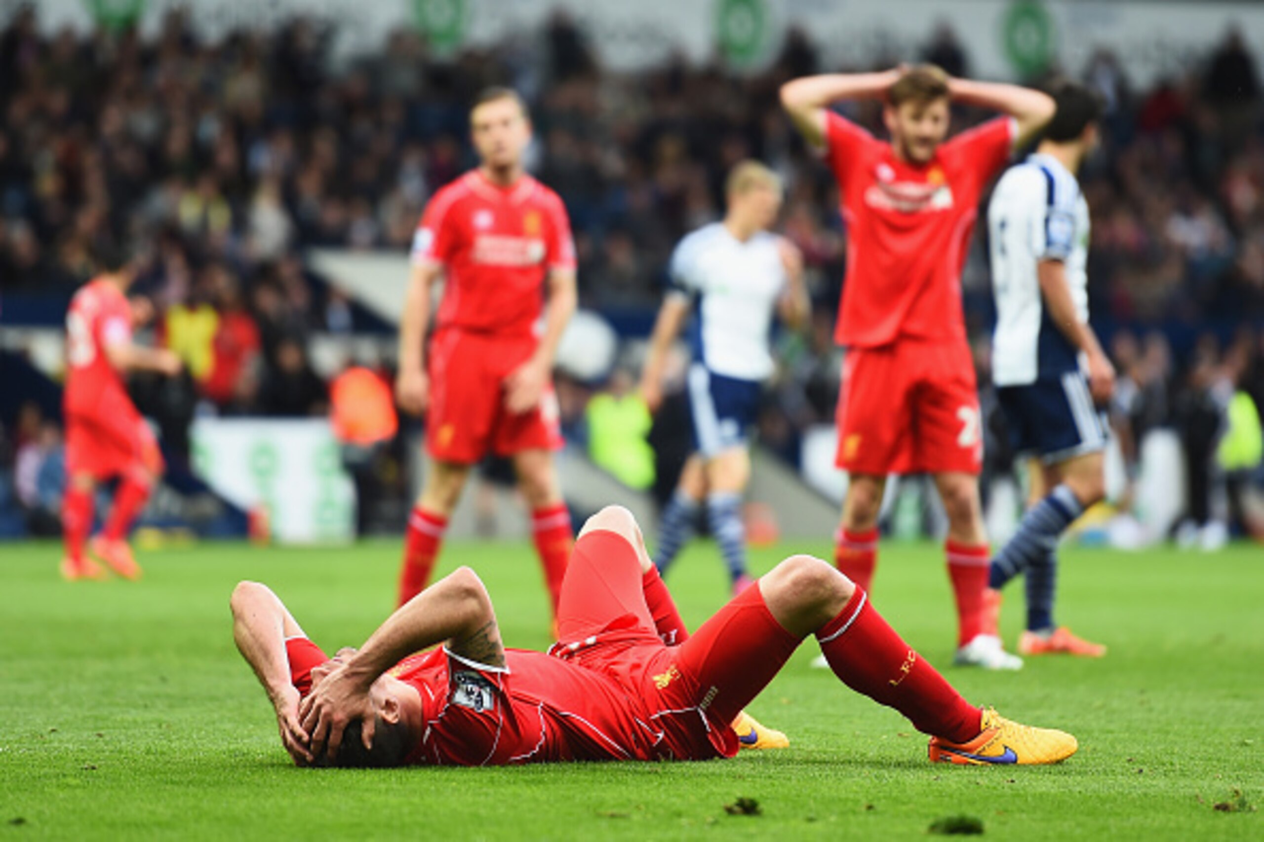 WEST BROMWICH, ENGLAND - APRIL 25:  Dejan Lovren of Liverpool lies on the pitch during the Barclays Premier League match between West Bromwich Albion and Liverpool at The Hawthorns on April 25, 2015 in West Bromwich, England.  (Photo by Laurence Griffiths