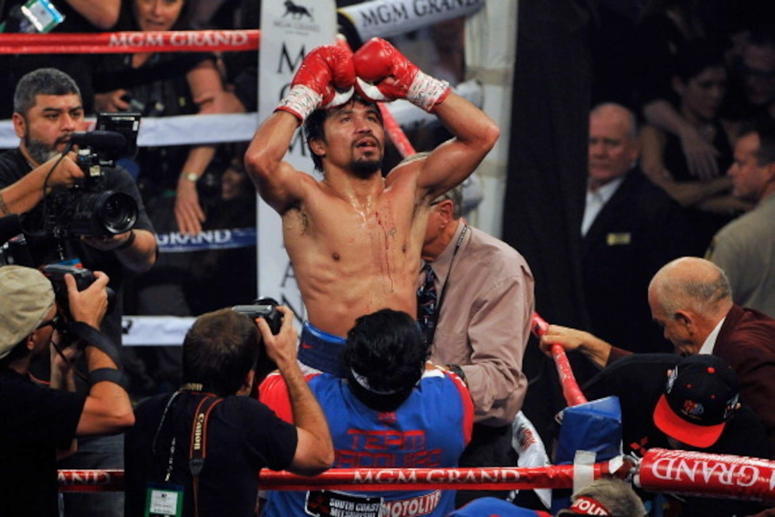LAS VEGAS, NV - APRIL 12:  (EDITORS NOTE: ALTERNATE CROP) Manny Pacquiao celebrates after his unanimous decision victory over Timothy Bradley during their WBO world welterweight championship boxing match at the MGM Grand Garden Arena on April 12, 2014 in 