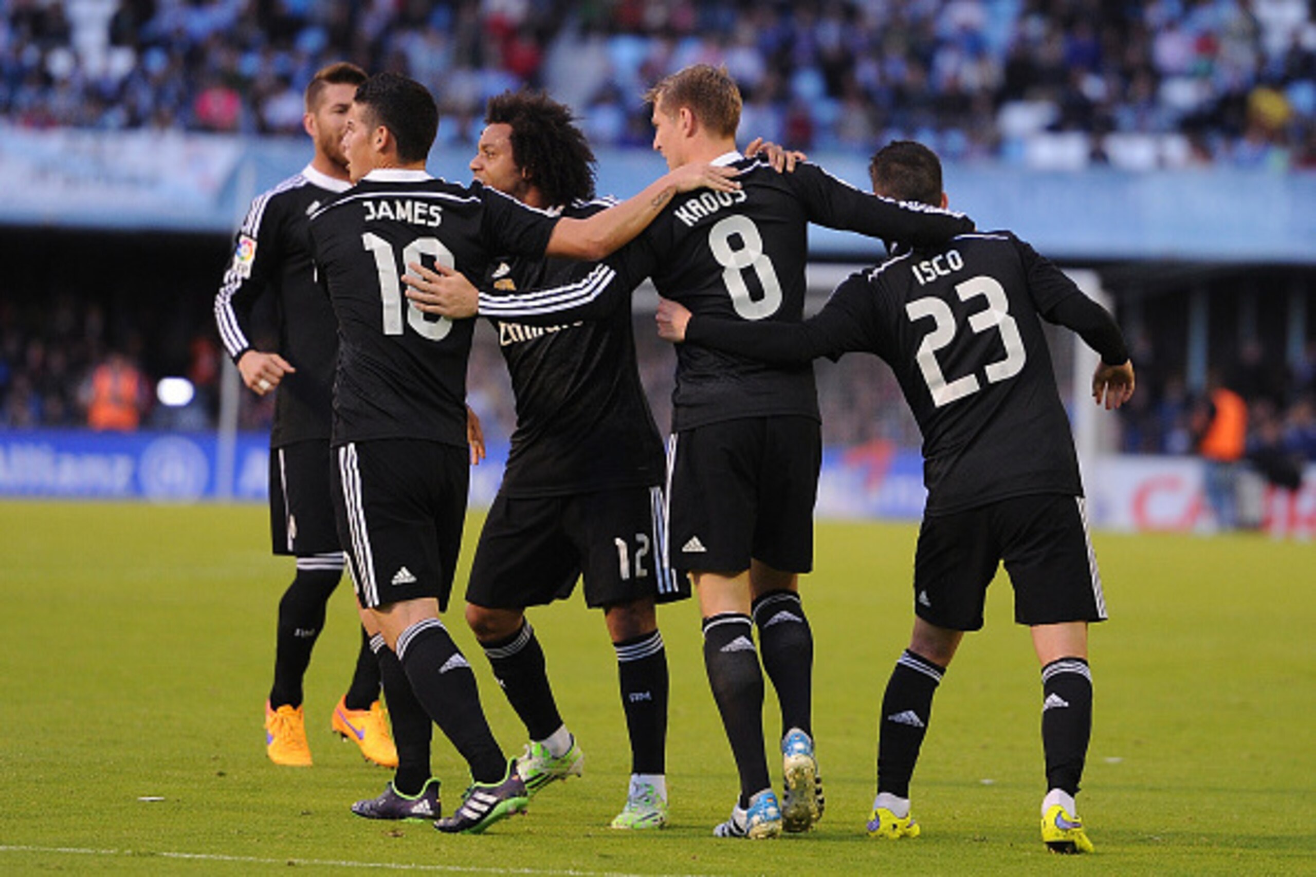 VIGO, SPAIN - APRIL 26:  Toni Kroos of Real Madrid celebrates with James Rodriguez and Isco after scoring Real's opening goal during the La Liga match between Celta Vigo and Real Madrid CF at Estadio Balaidos on April 26, 2015 in Vigo, Spain.  (Photo by D