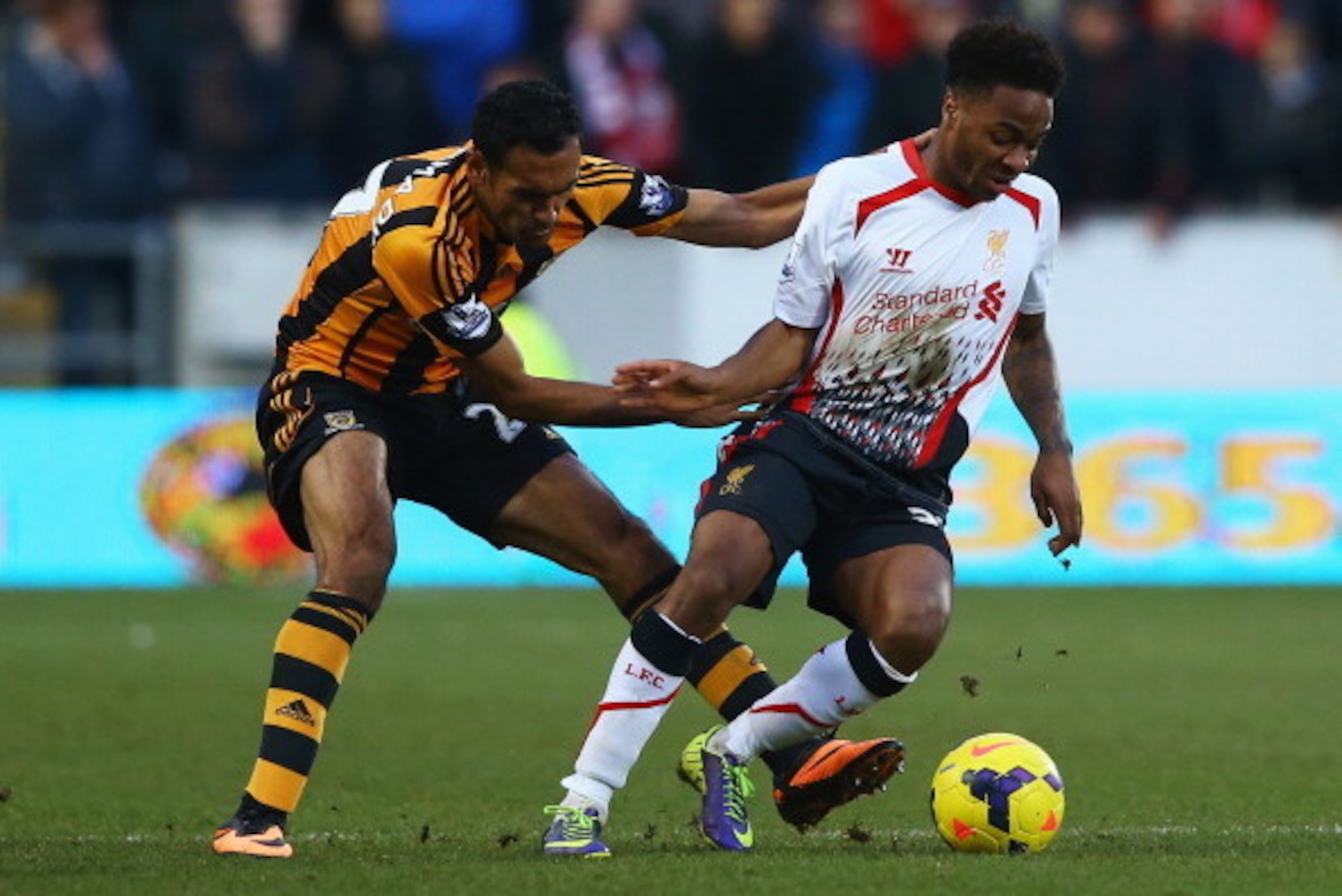 HULL, ENGLAND - DECEMBER 01: Raheem Sterling of Liverpool is closed down by Ahmed Elmohamady of Hull City during the Barclays Premier League match between Hull City and Liverpool at KC Stadium on December 1, 2013 in Hull, England. (Photo by Matthew Lewi HULL, ENGLAND - DECEMBER 01: Raheem Sterling of Liverpool is closed down by Ahmed Elmohamady of Hull City during the Barclays Premier League match between Hull City and Liverpool at KC Stadium on December 1, 2013 in Hull, England. (Photo by Matthew Lewi