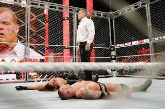 Kane lays out both Seth Rollins and Randy Orton.