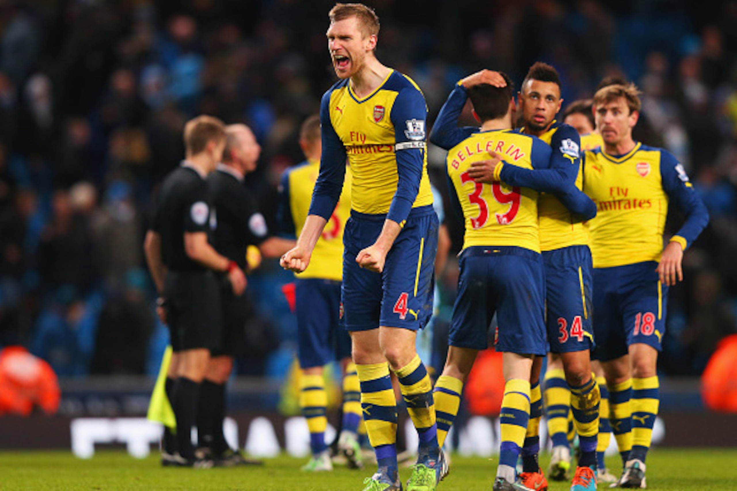 MANCHESTER, ENGLAND - JANUARY 18:  Per Mertesacker of Arsenal celebrates victory with team mates after the Barclays Premier League match between Manchester City and Arsenal at Etihad Stadium on January 18, 2015 in Manchester, England.  (Photo by Alex Live