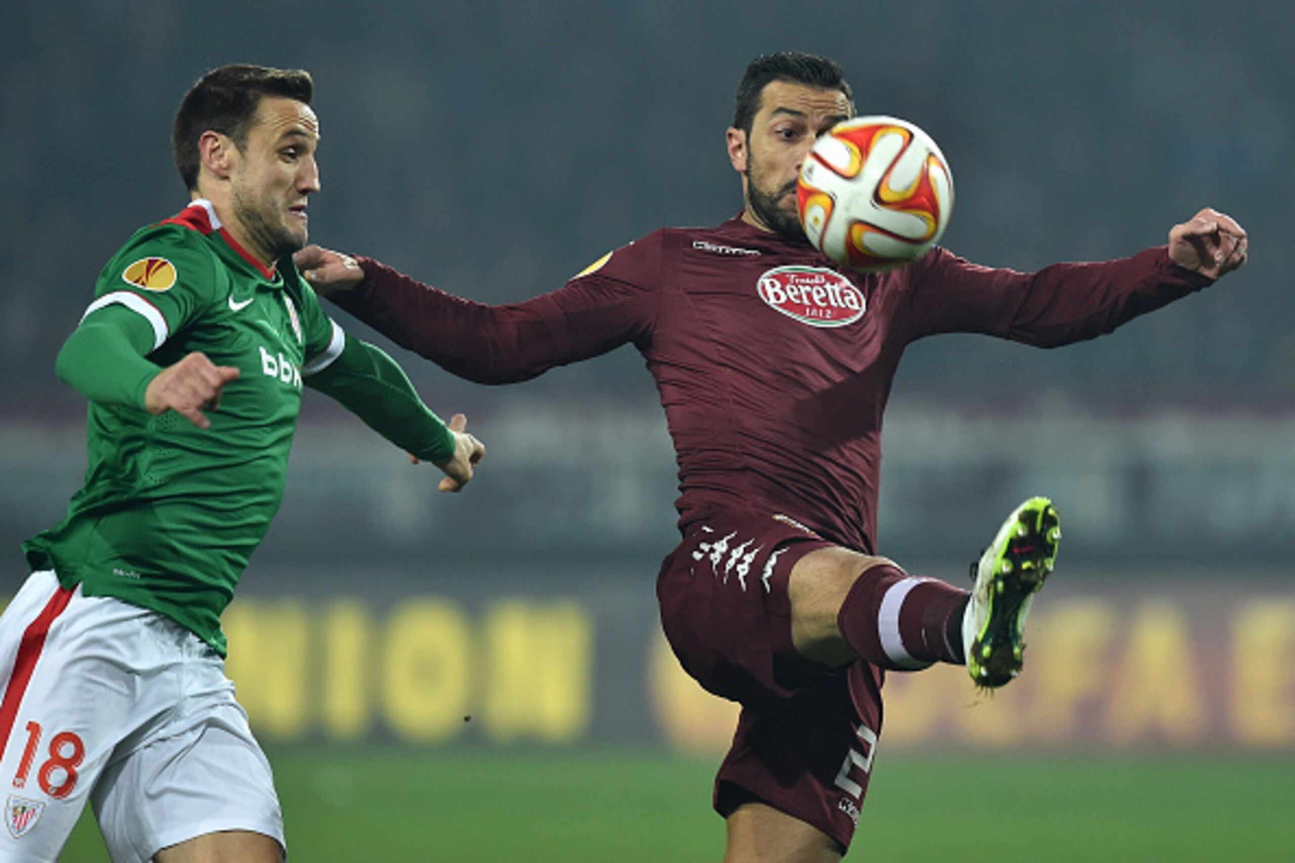 TURIN, ITALY - FEBRUARY 19:  Fabio Quagliarella (R) of Torino FC is challenged by Carlos Gurpegi of Athletic Club during the UEFA Europa League Round of 32 match between Torino FC and Athletic Club on February 19, 2015 in Turin, Italy.  (Photo by Valerio 