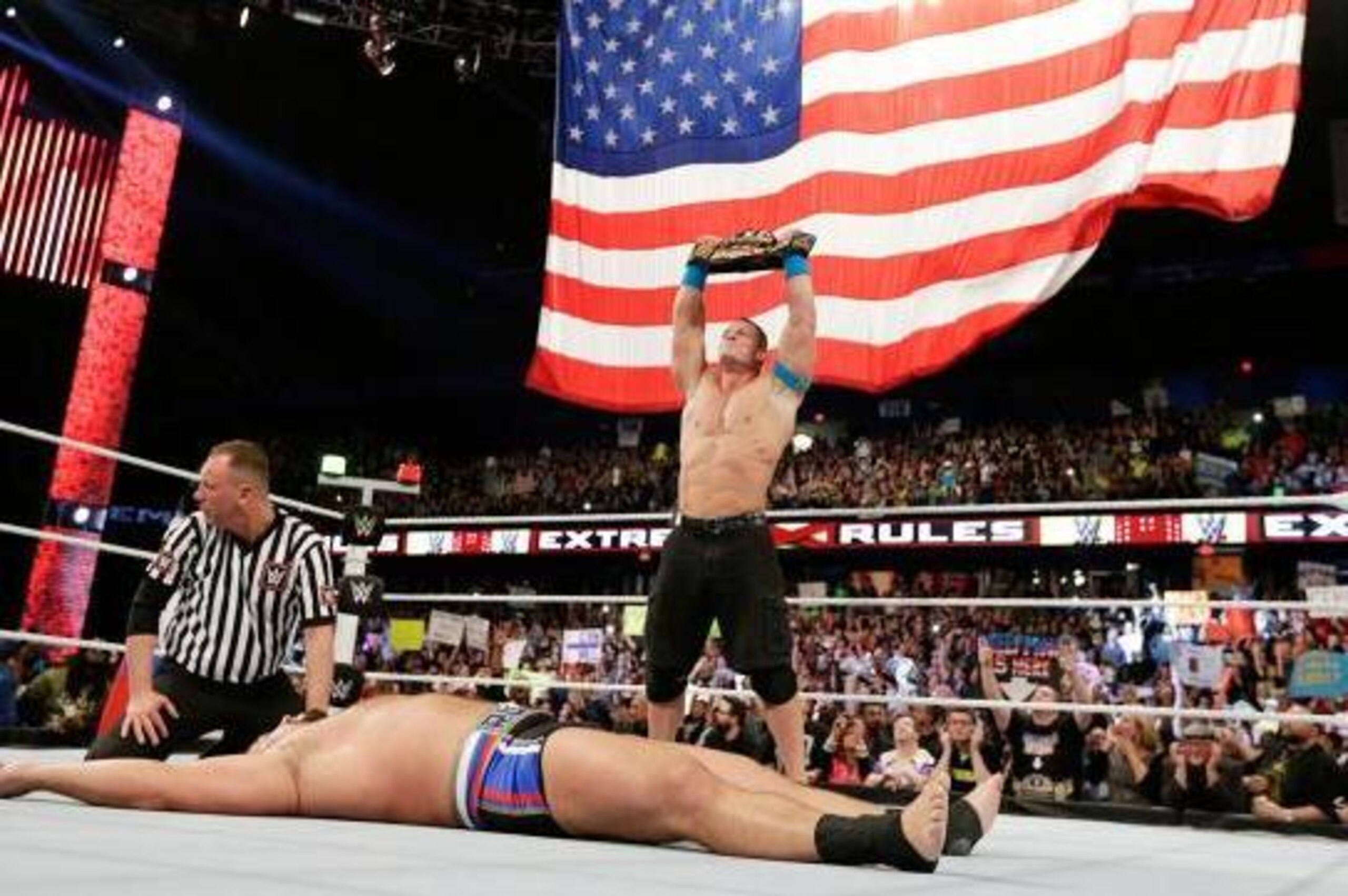 John Cena celebrates his win over Rusev.