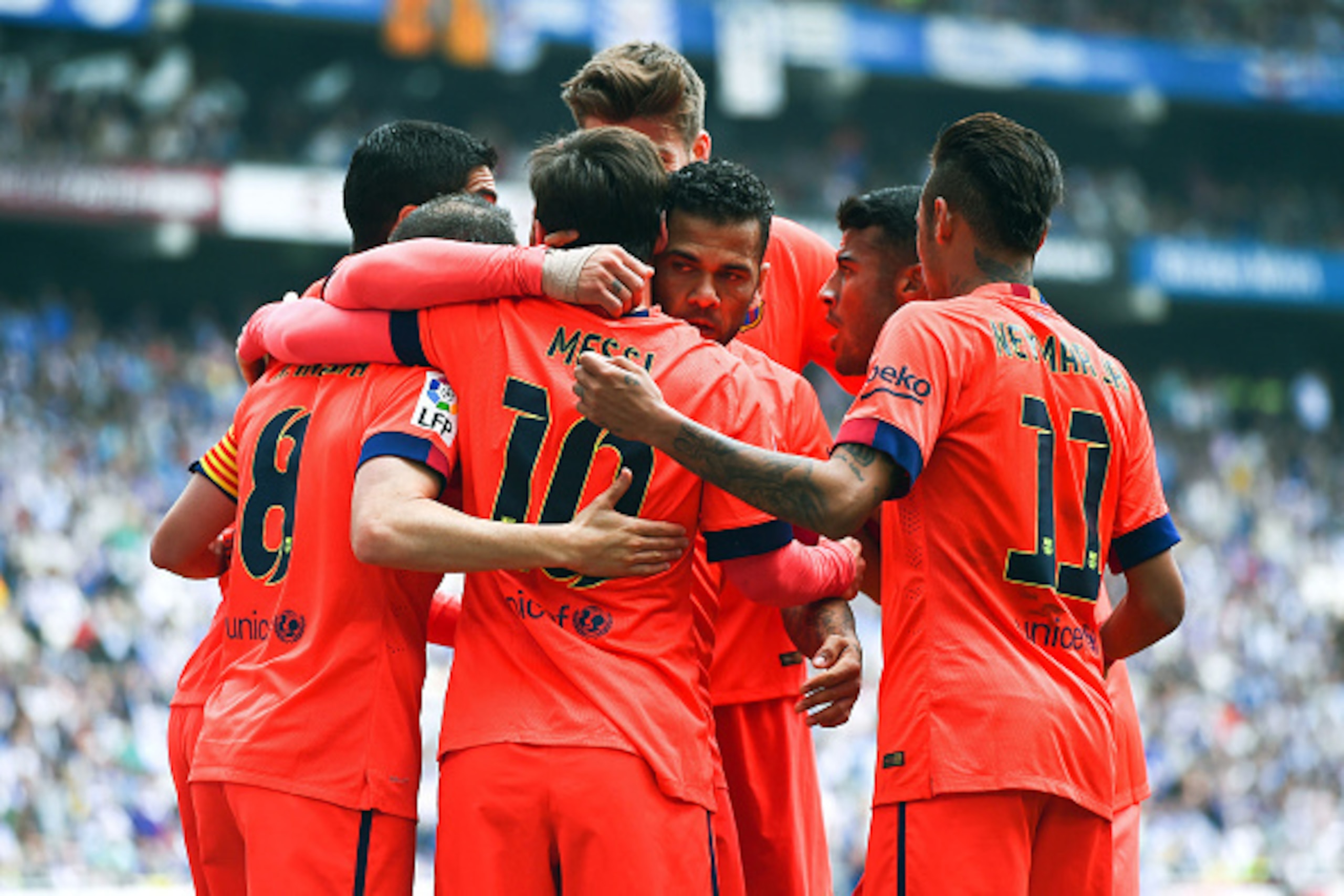 BARCELONA, SPAIN - APRIL 25:  FC Barcelona players celebrate after Lionel Messi (C) of FC Barcelona scored his team's second goal during the La Liga match between RCD Espanyol and FC Barcelona at Cornella-El Prat Stadium on April 25, 2015 in Barcelona, Sp