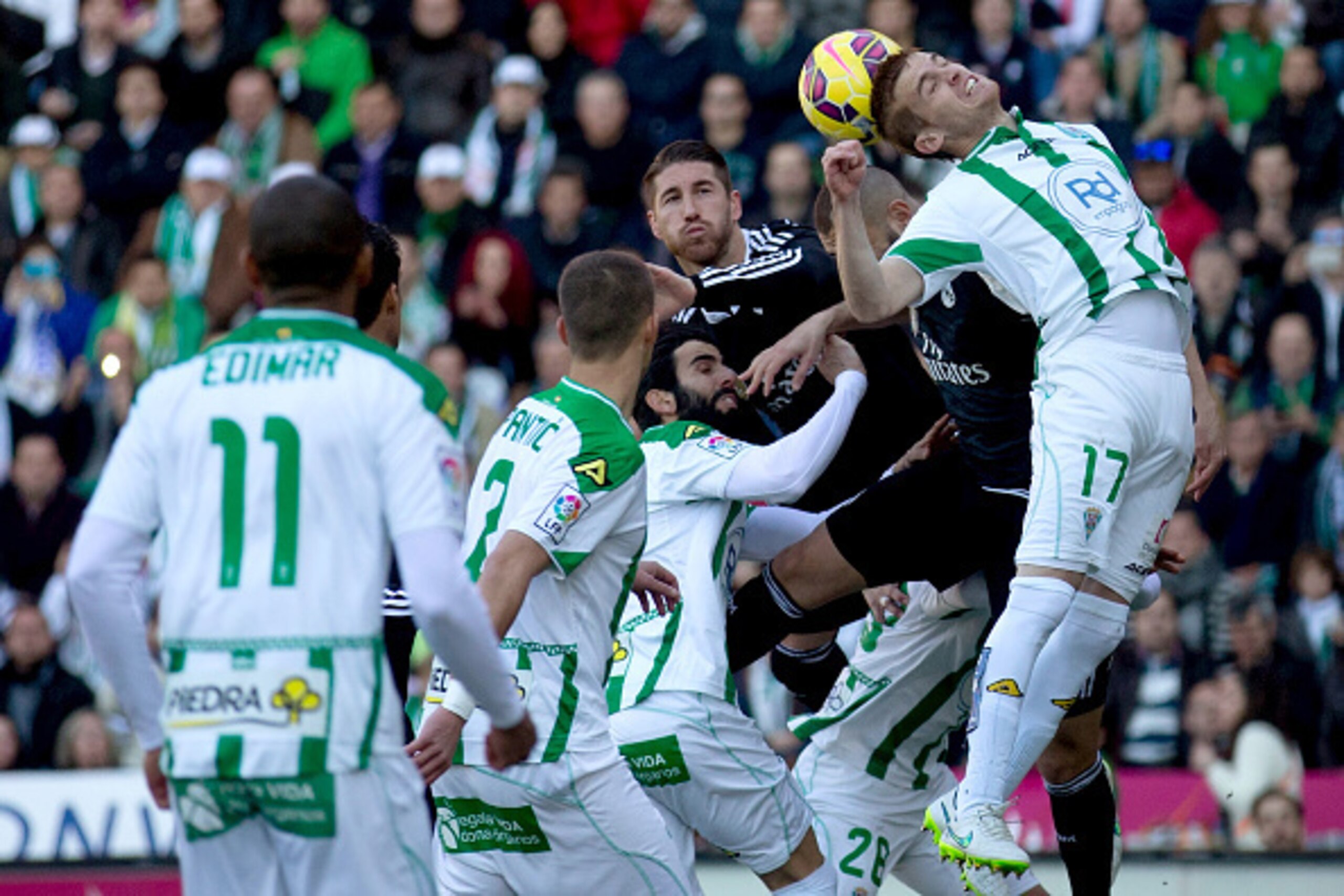 CORDOBA, SPAIN - JANUARY 24: Adrin Gunino of Cordoba CF wins the header during the La Liga match between Cordoba CF and Real Madrid CF at El Arcangel stadium on January 24, 2015 in Cordoba, Spain.  (Photo by Gonzalo Arroyo Moreno/Getty Images)