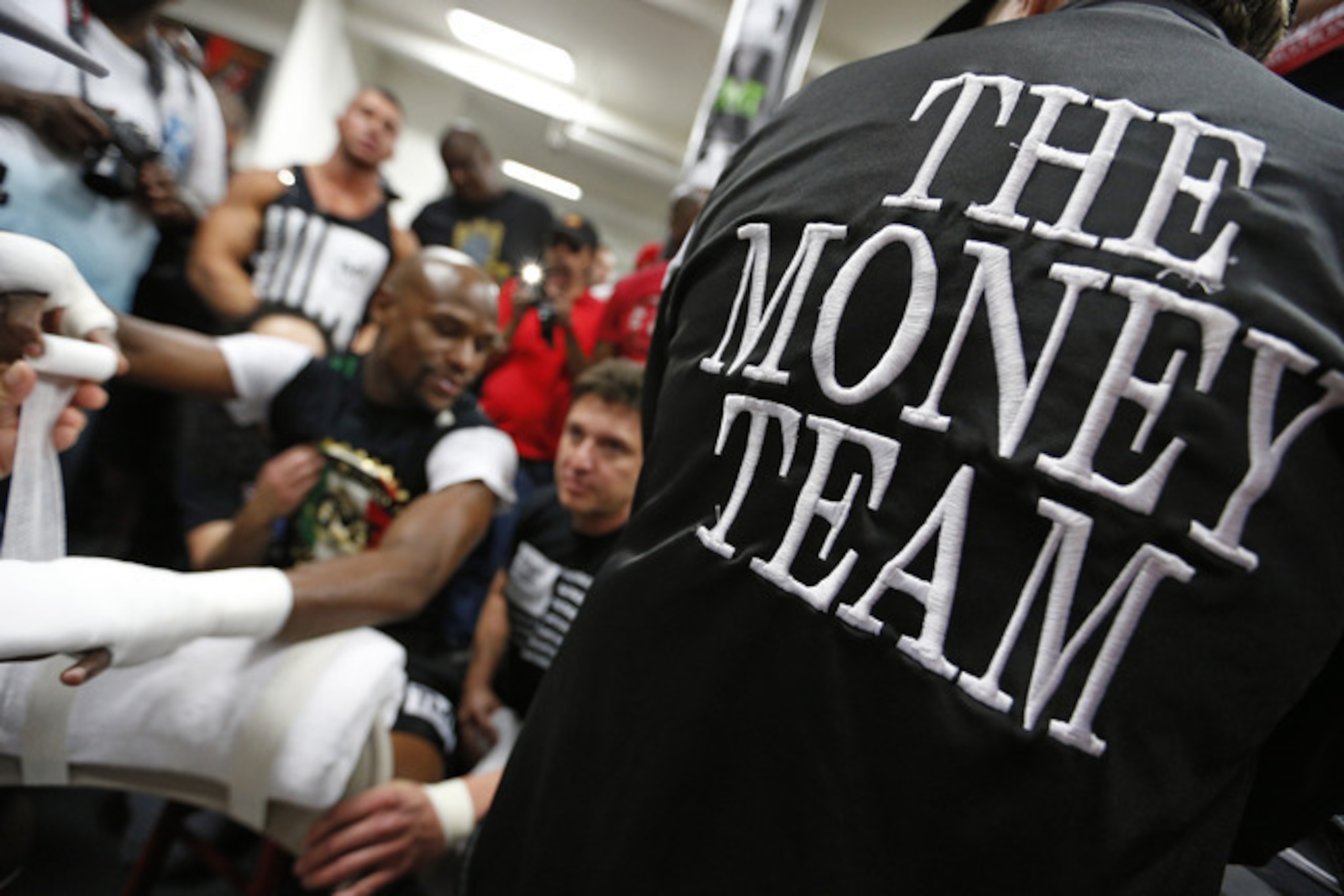 Floyd amid a media horde at his gym in Vegas.
