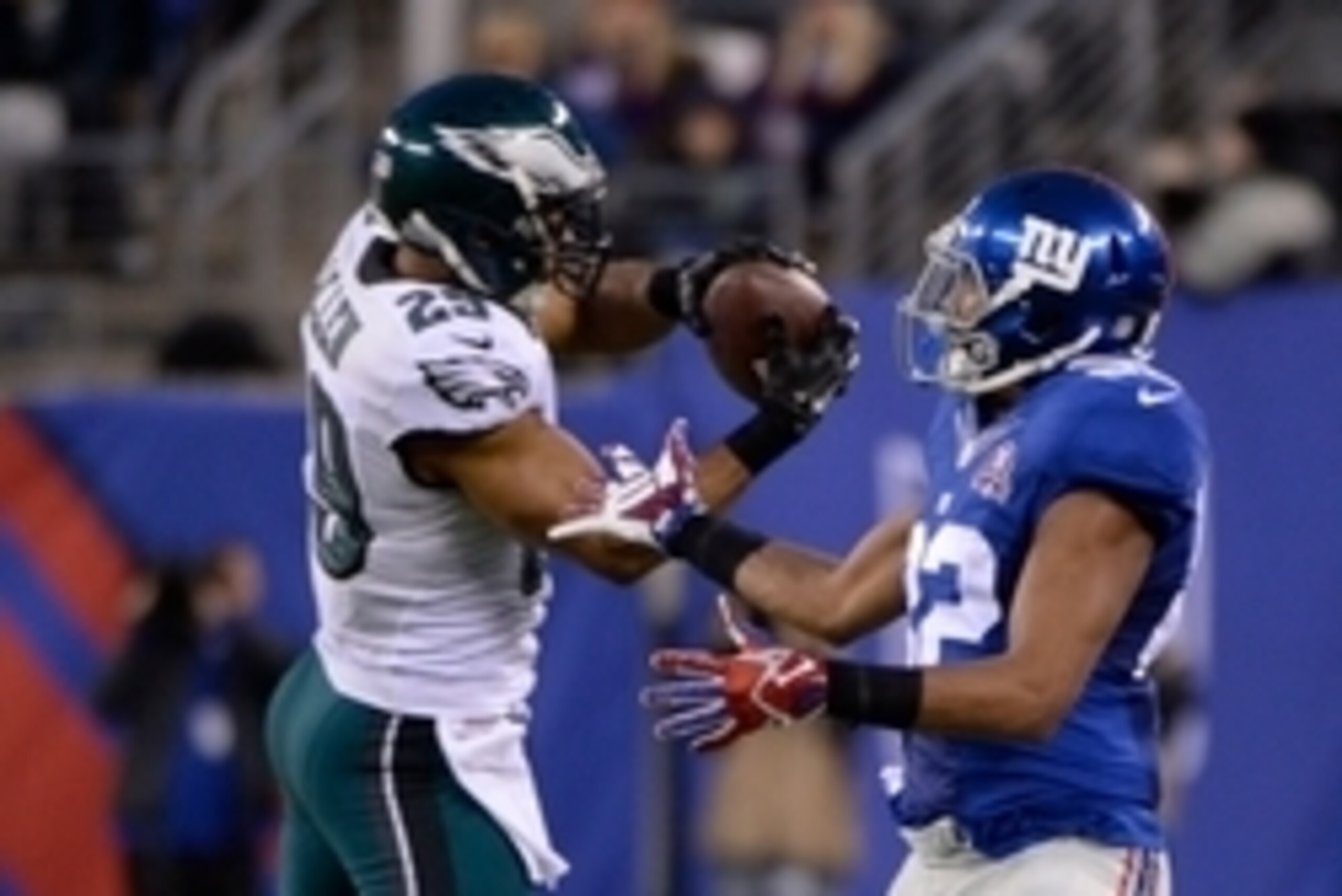 Dec 28, 2014; East Rutherford, NJ, USA; Philadelphia Eagles strong safety Nate Allen (29) intercepts a pass intended for New York Giants wide receiver Rueben Randle (82) in the fourth quarter during the game at MetLife Stadium. Mandatory Credit: Robert De