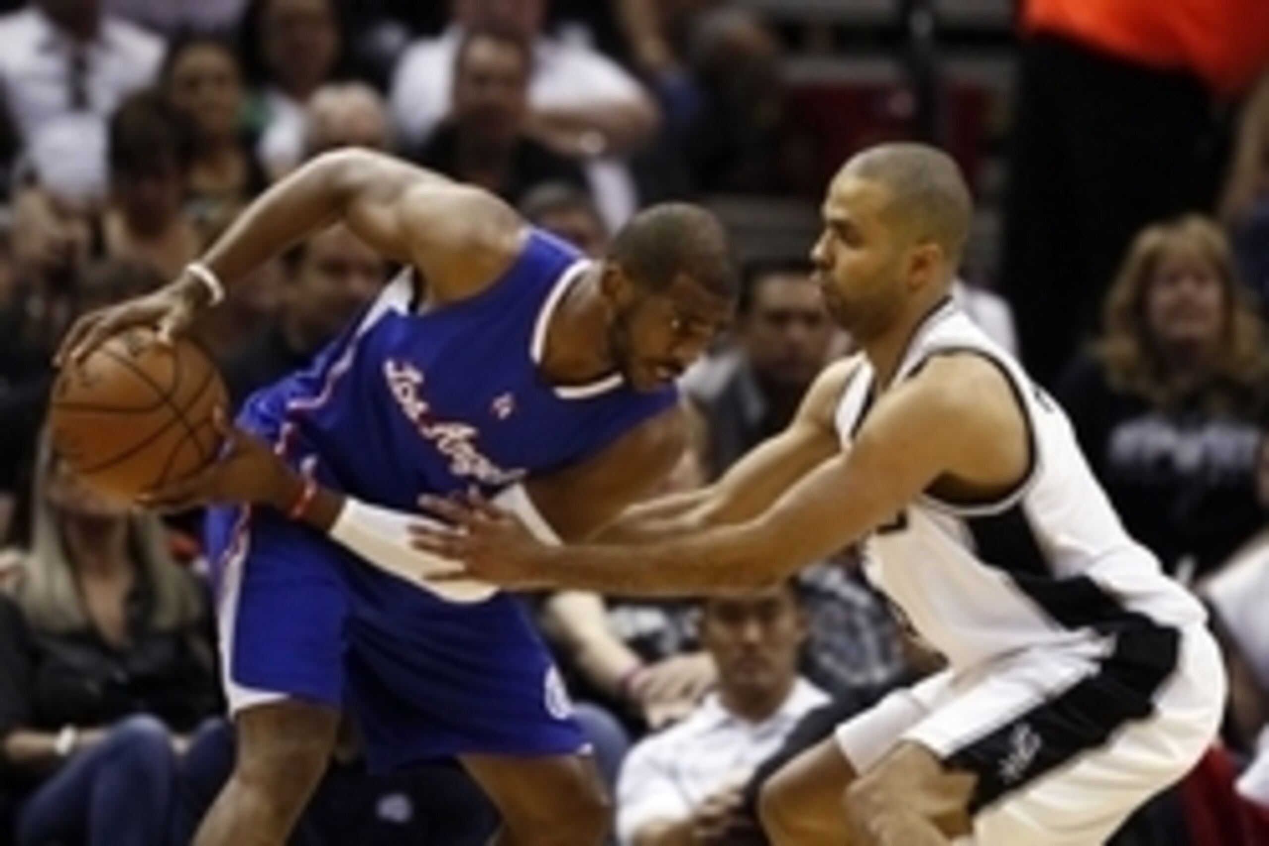Apr 26, 2015; San Antonio, TX, USA; Los Angeles Clippers point guard Chris Paul (L) is defended by San Antonio Spurs point guard Tony Parker (R) in game four of the first round of the NBA Playoffs at AT&T Center. Mandatory Credit: Soobum Im-USA TODAY Spor Apr 26, 2015; San Antonio, TX, USA; Los Angeles Clippers point guard Chris Paul (L) is defended by San Antonio Spurs point guard Tony Parker (R) in game four of the first round of the NBA Playoffs at AT&T Center. Mandatory Credit: Soobum Im-USA TODAY Spor