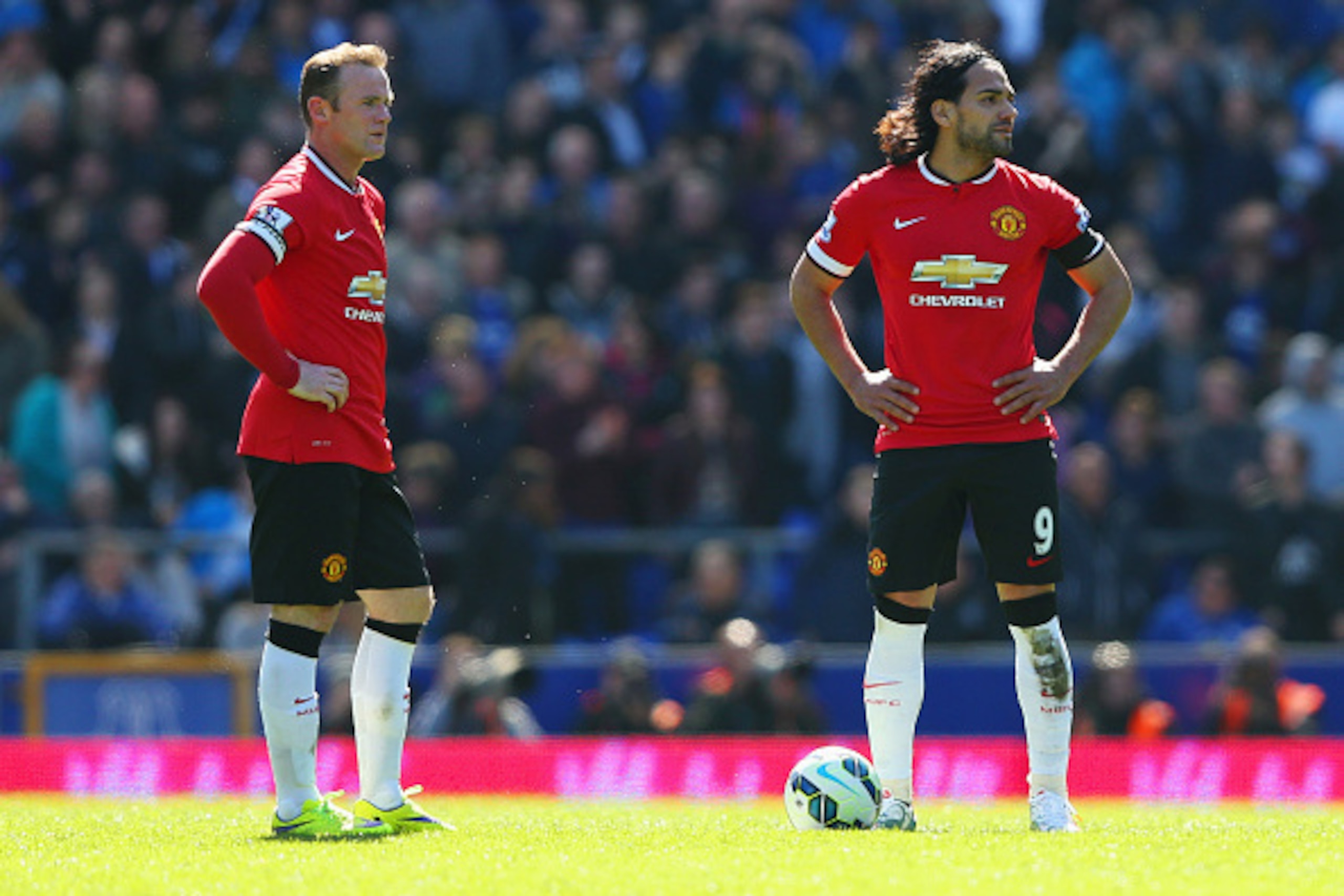 LIVERPOOL, ENGLAND - APRIL 26:  Radamel Falcao Garcia (9) and Wayne Rooney of Manchester United look dejected as Kevin Mirallas of Everton scores their third goal during the Barclays Premier League match between Everton and Manchester United at Goodison P