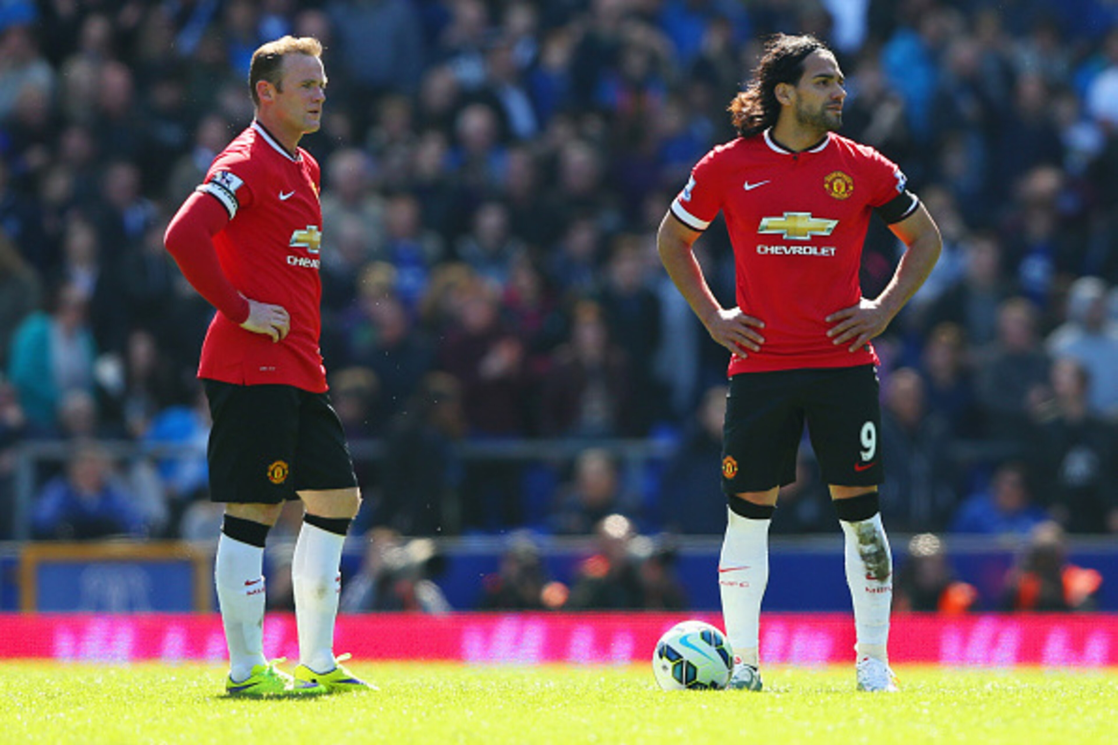 LIVERPOOL, ENGLAND - APRIL 26:  Radamel Falcao Garcia (9) and Wayne Rooney of Manchester United look dejected as Kevin Mirallas of Everton scores their third goal during the Barclays Premier League match between Everton and Manchester United at Goodison P