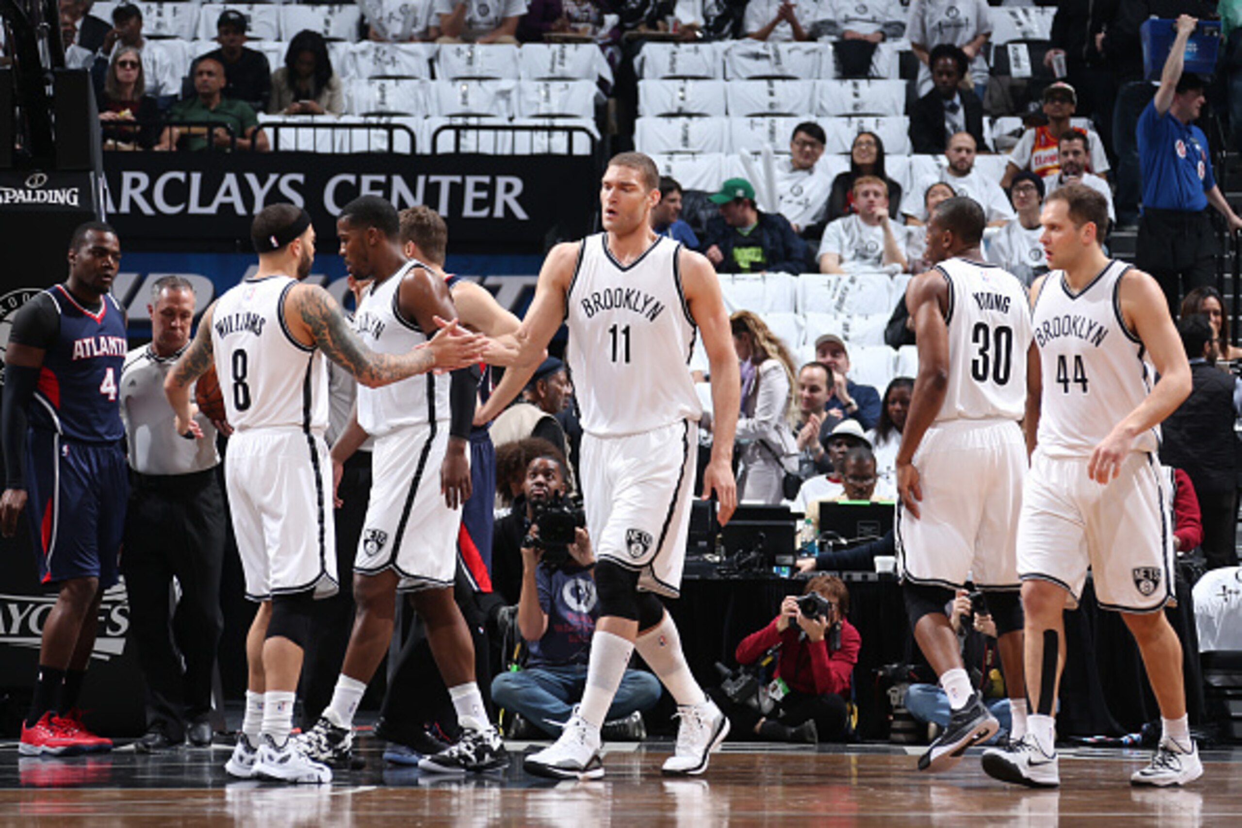BROOKLYN, NY - APRIL 27:  Brook Lopez #11 of the Brooklyn Nets high fives teammates during Game Four of the Eastern Conference Quarterfinals against the Atlanta Hawks during the NBA Playoffs on April 27, 2015 at Barclays Center in Brooklyn, NY. NOTE TO US