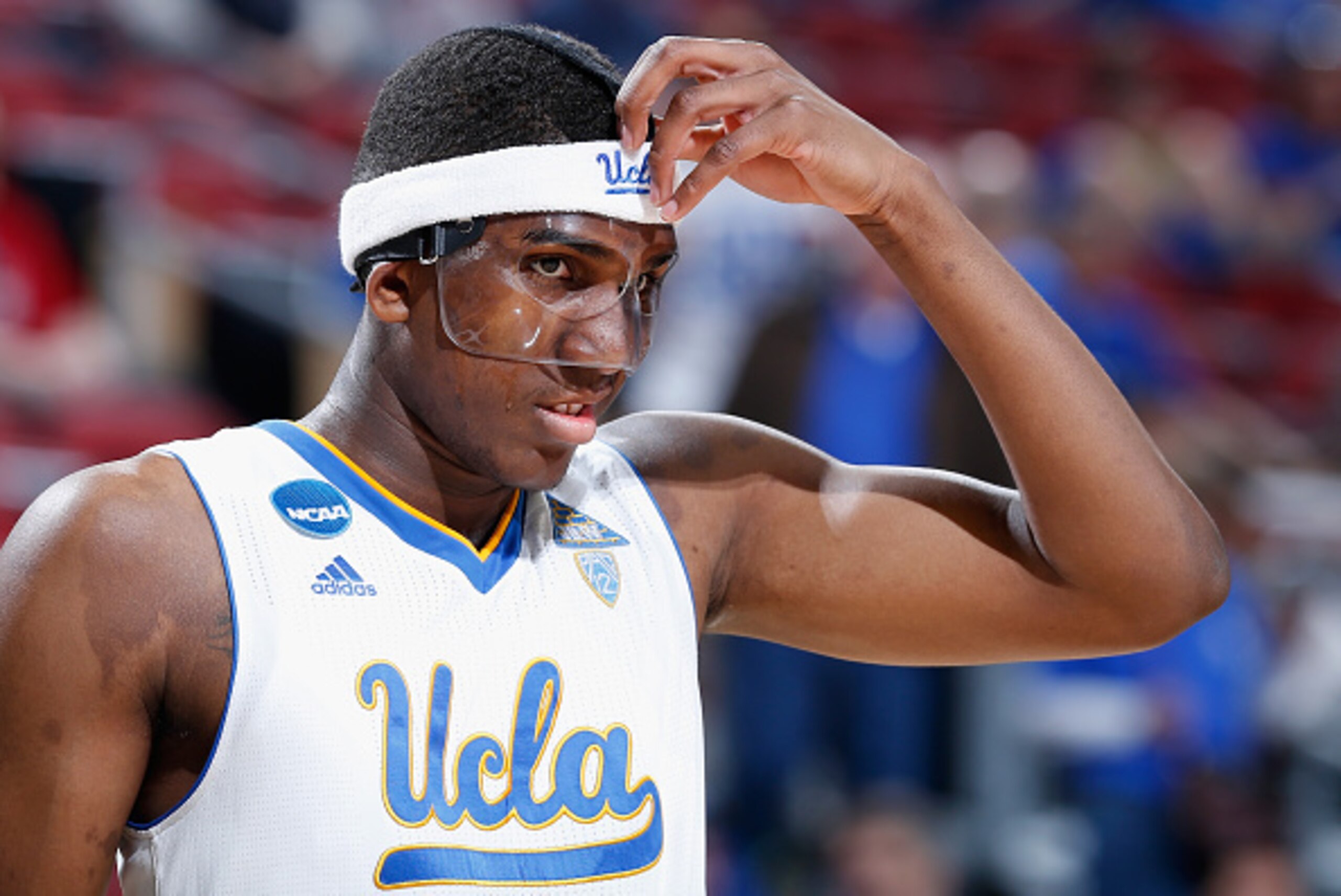 LOUISVILLE, KY - MARCH 21:  Kevon Looney #5 of the UCLA Bruins fixes his facemask against the UAB Blazers during the third round of the 2015 NCAA Men's Basketball Tournament at KFC YUM! Center on March 21, 2015 in Louisville, Kentucky.  (Photo by Joe Robb