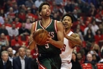 Apr 27, 2015; Chicago, IL, USA; Milwaukee Bucks guard Michael Carter-Williams (5) drives to the basket against Chicago Bulls guard Derrick Rose (1) in game five of the first round of the 2015 NBA Playoffs at United Center. Mandatory Credit: Kamil Krzaczyn