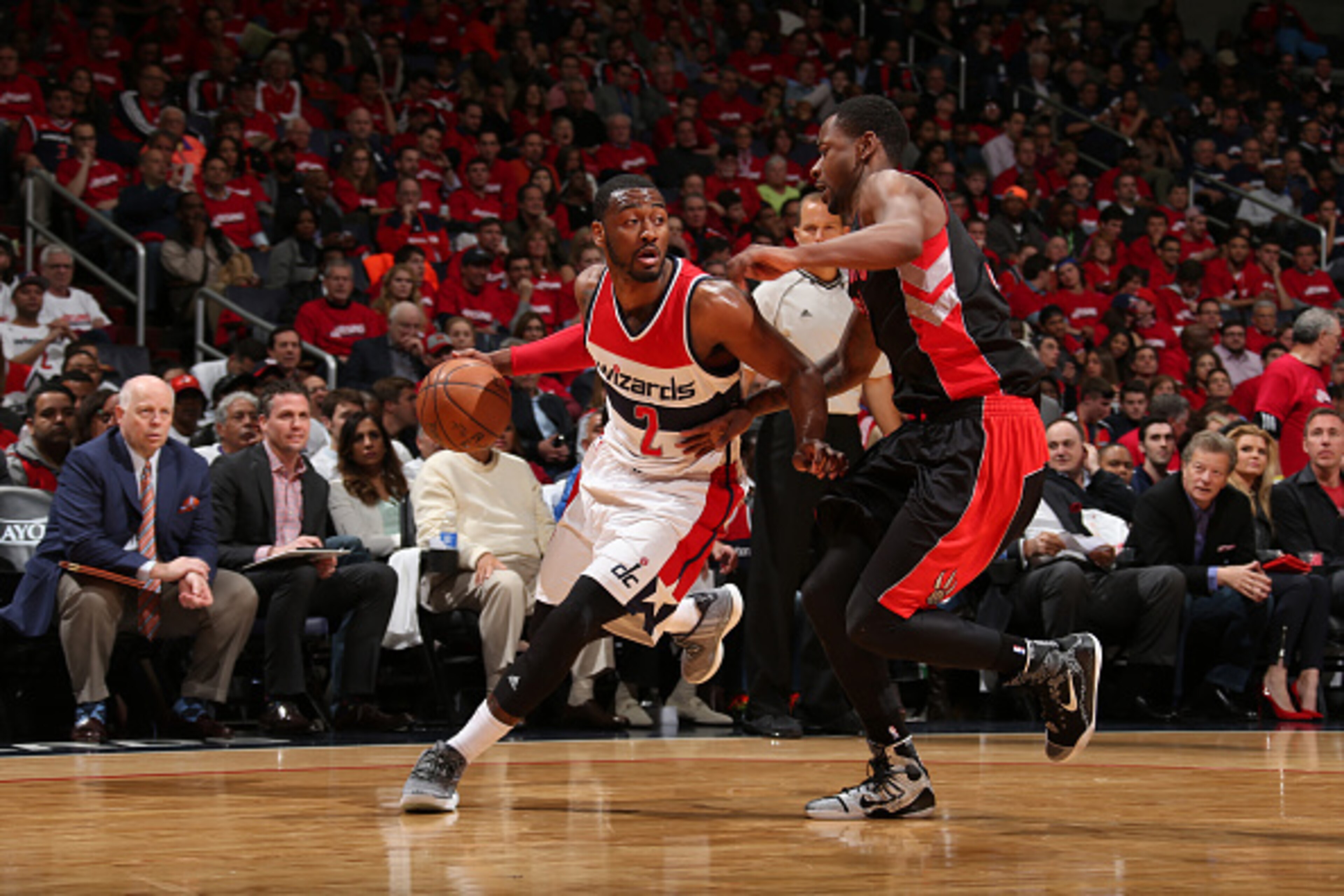 WASHINGTON, DC -  APRIL 24:  John Wall #2 of the Washington Wizards handles the ball against the Toronto Raptors in Game Three of the Eastern Conference Quarterfinals during the 2015 NBA Playoffs on April 24, 2015 at Verizon Center in Washington, DC. NOTE