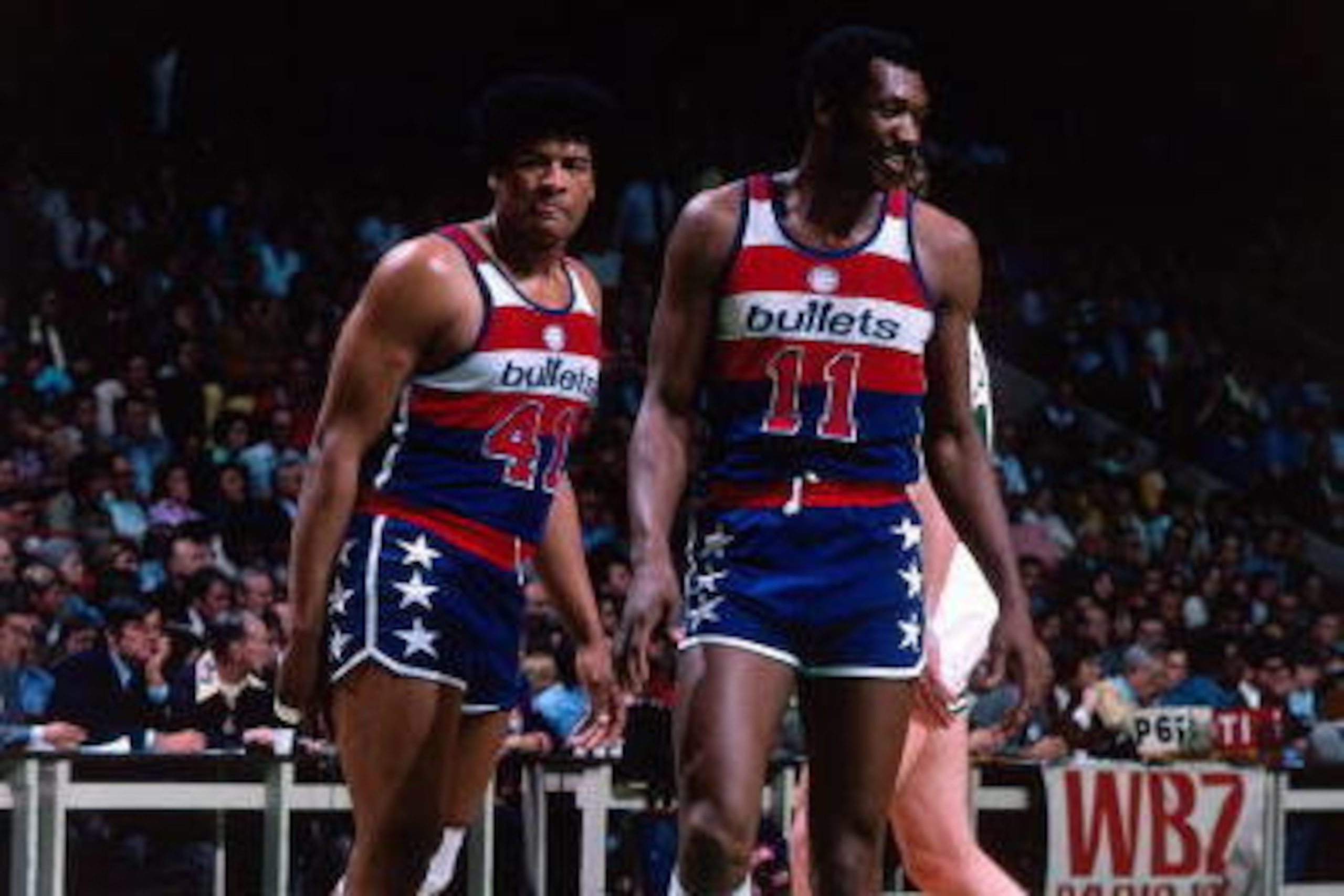 BOSTON - 1975:  Wes Unseld #41 and Elvin Hayes #11 of the Washington Bullets walk on the court against the Boston Celtics during a game played in 1975 at the Boston Garden in Boston, Massachusetts. NOTE TO USER: User expressly acknowledges and agrees that