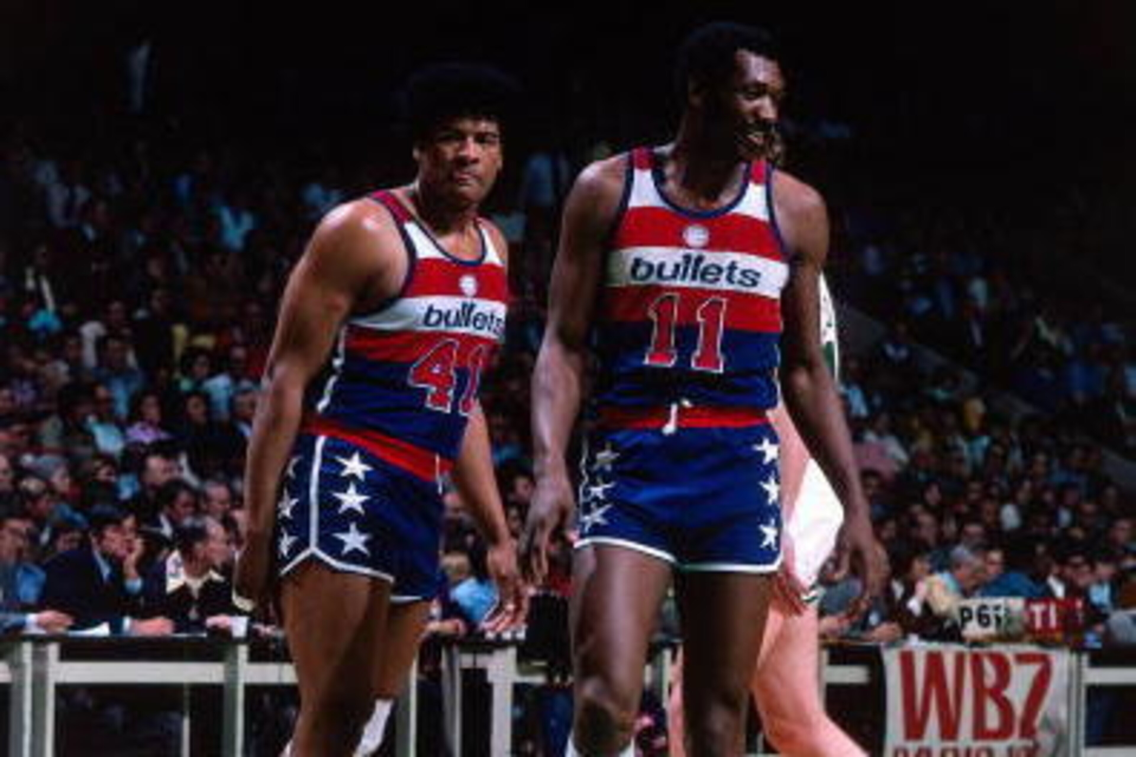 BOSTON - 1975:  Wes Unseld #41 and Elvin Hayes #11 of the Washington Bullets walk on the court against the Boston Celtics during a game played in 1975 at the Boston Garden in Boston, Massachusetts. NOTE TO USER: User expressly acknowledges and agrees that