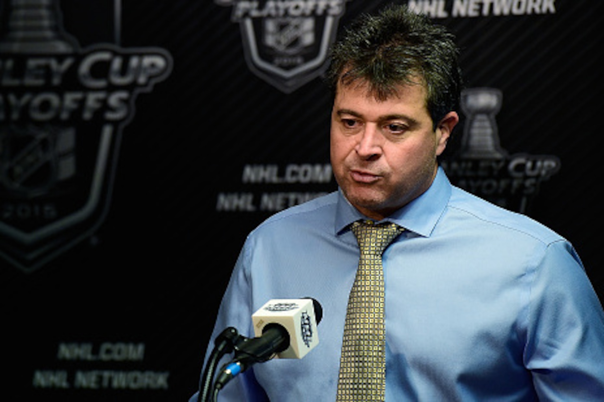 WASHINGTON, DC - APRIL 15:  Head coach Jack Capuano of the New York Islanders speaks to members of the press after the Islanders defeated the Washington Capitals 4-1 in Game One of the Eastern Conference Quarterfinals during the 2015 NHL Stanley Cup Playo