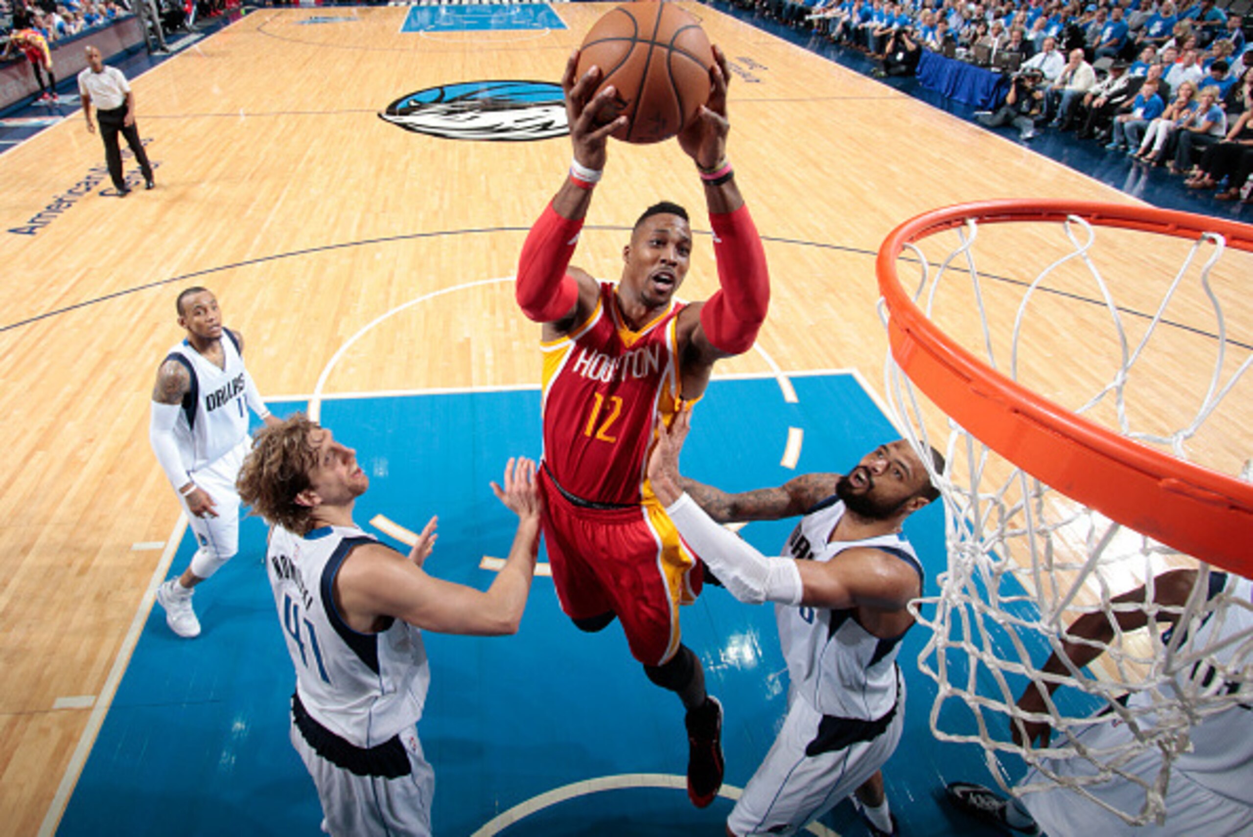 DALLAS, TX - APRIL 26: Dwight Howard #12 of the Houston Rockets grabs a rebound against the Dallas Mavericks during Game Four of the Western Conference Quarterfinals of the 2015 NBA Playoffs on April 26, 2015 at the American Airlines Center in Dallas, Tex