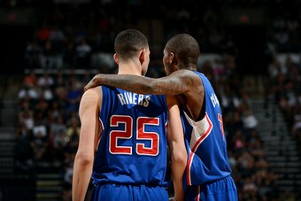 SAN ANTONIO - APRIL 26: Jamal Crawford #11 and Austin Rivers #25 of the Los Angeles Clippers celebrate during a game against the San Antonio Spurs during Game Four of the Western Conference Quarterfinals at the AT&T Center on April 26, 2015 in San Antonio