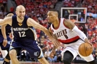 Apr 27, 2015; Portland, OR, USA; Portland Trail Blazers guard Damian Lillard (0) drives past Memphis Grizzlies guard Nick Calathes (12) during the second quarter in game four of the first round of the NBA Playoffs at the Moda Center. Mandatory Credit: Cra