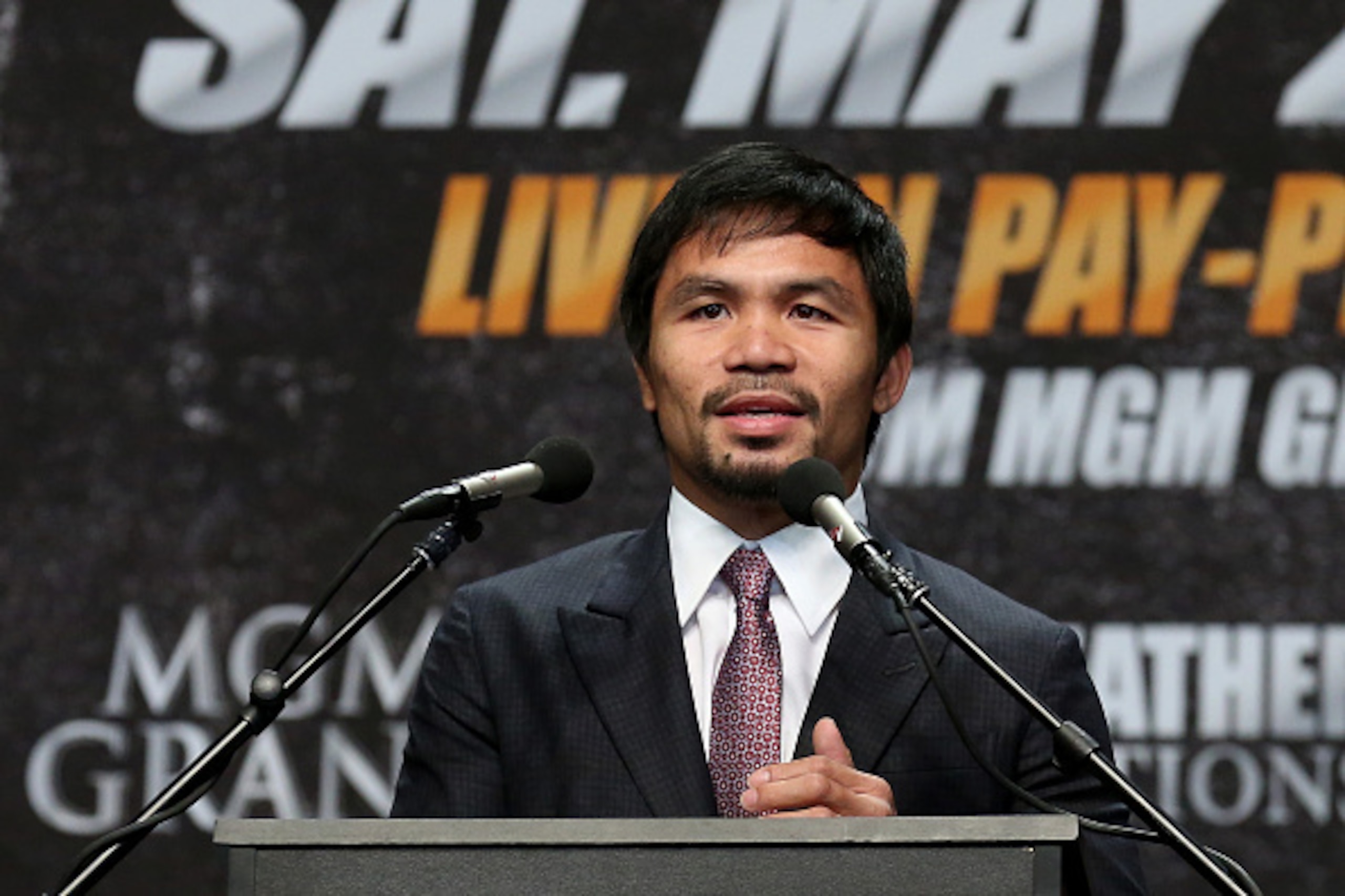 LOS ANGELES, CA - MARCH 11: Manny Pacquiao speaks at the  Floyd Mayweather v Manny Pacquiao  Press Conference on March 11, 2015 in Los Angeles, California.  (Photo by Stephen Dunn/Getty Images)