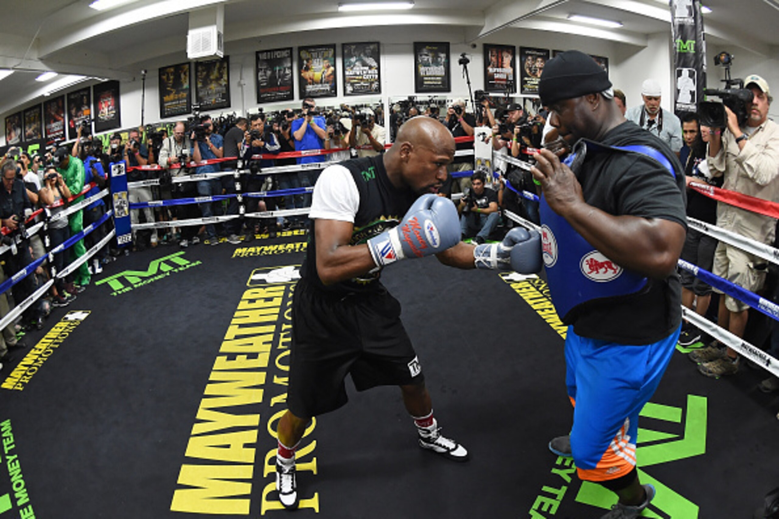 LAS VEGAS, NV - APRIL 14:  WBC/WBA welterweight champion Floyd Mayweather Jr. (L) works out with co-trainer Nate Jones at the Mayweather Boxing Club on April 14, 2015 in Las Vegas, Nevada. Mayweather will face WBO welterweight champion Manny Pacquiao in a