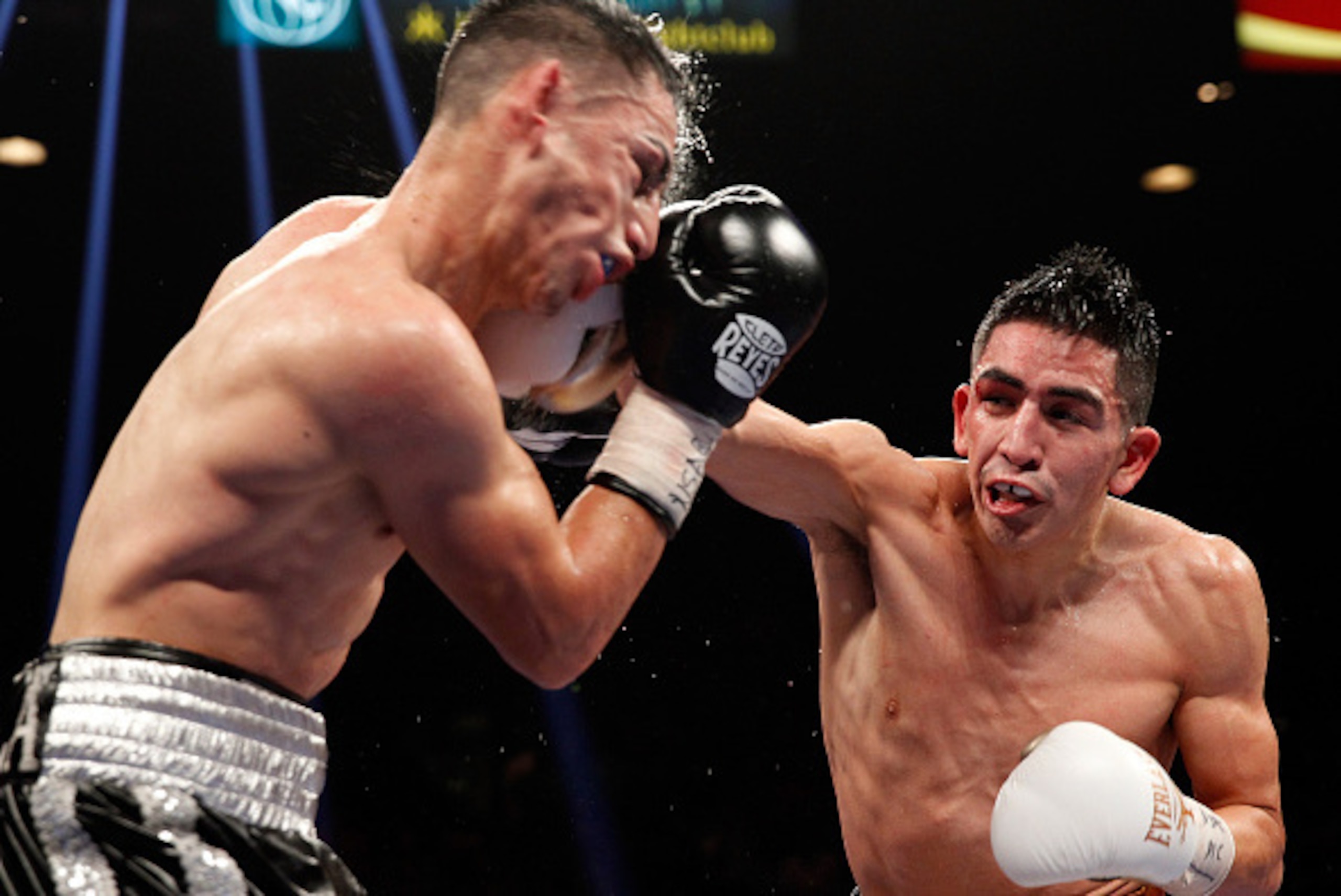 LAS VEGAS, NV - JANUARY 17:  WBC super bantamweight champion Leo Santa Cruz (R) lands a punch on Jesus Ruiz during their title fight at the MGM Grand Garden Arena on January 17, 2015 in Las Vegas, Nevada. Santa Cruz retained his title with an eighth-round