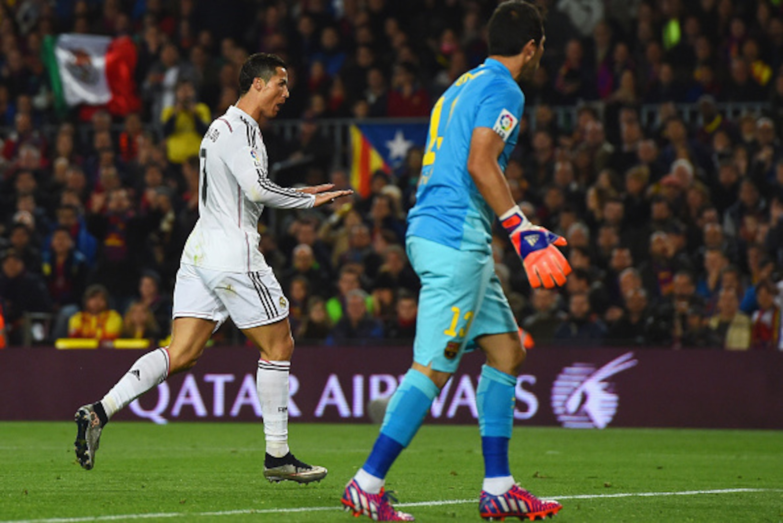BARCELONA, SPAIN - MARCH 22:  Claudio Bravo of Barcelona looks on as Cristiano Ronaldo of Real Madrid CF celebrates as he scores their first and equalising goal during the La Liga match between FC Barcelona and Real Madrid CF at Camp Nou on March 22, 2015