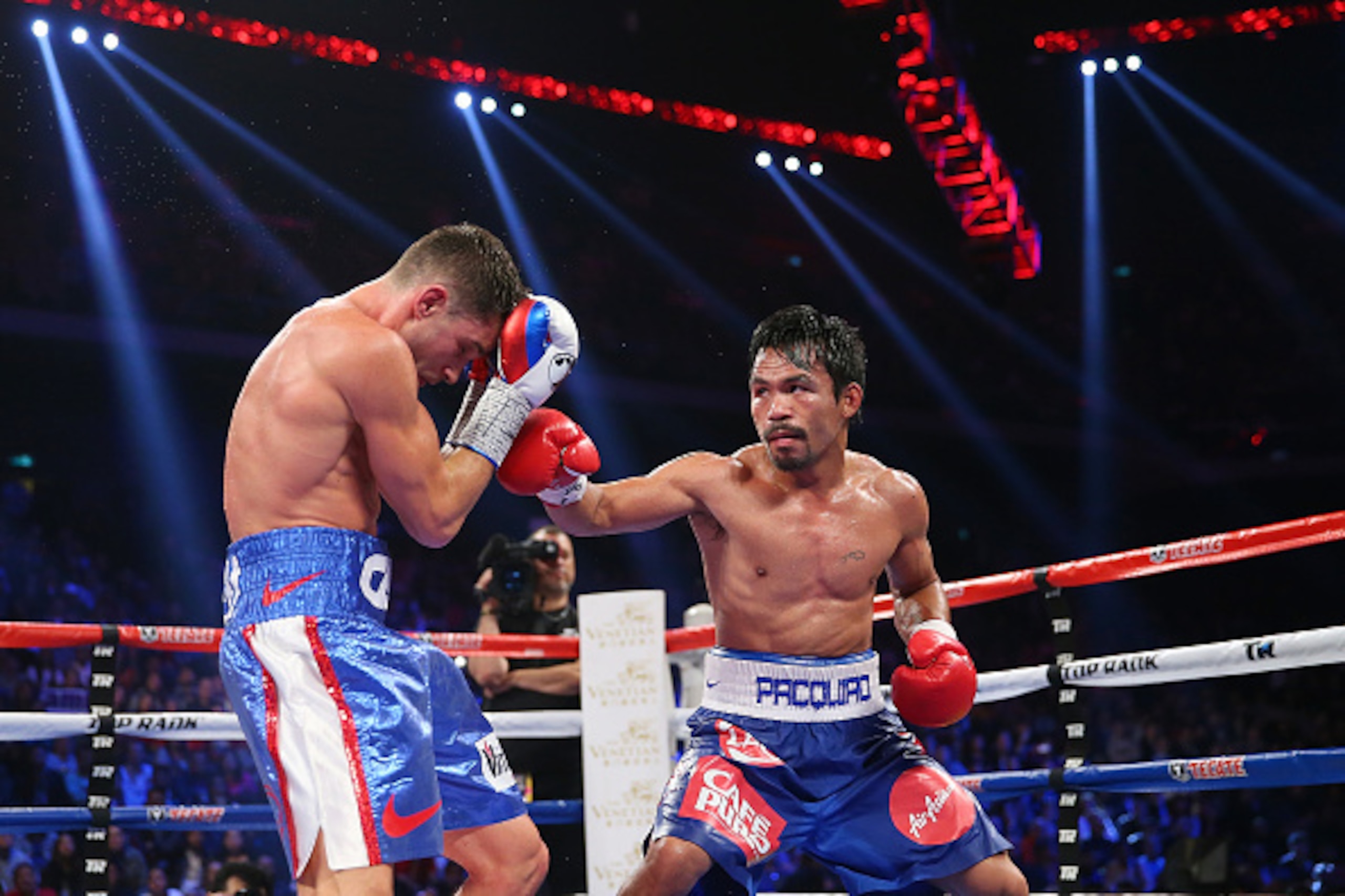 MACAU - NOVEMBER 23: Manny Pacquiao of the Philippines punches Chris Algieri of the United States during the WBO world welterweight title at The Venetian on November 23, 2014 in Macau, Macau. (Photo by Chris Hyde/Getty Images) MACAU - NOVEMBER 23: Manny Pacquiao of the Philippines punches Chris Algieri of the United States during the WBO world welterweight title at The Venetian on November 23, 2014 in Macau, Macau. (Photo by Chris Hyde/Getty Images)