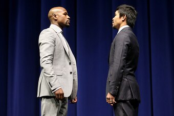 LOS ANGELES, CA - MARCH 11:  Floyd Mayweather (L) and Manny Pacquiao face off at the start of their Press Conference promoting their upcoming fight on March 11, 2015 in Los Angeles, California.  (Photo by Stephen Dunn/Getty Images)