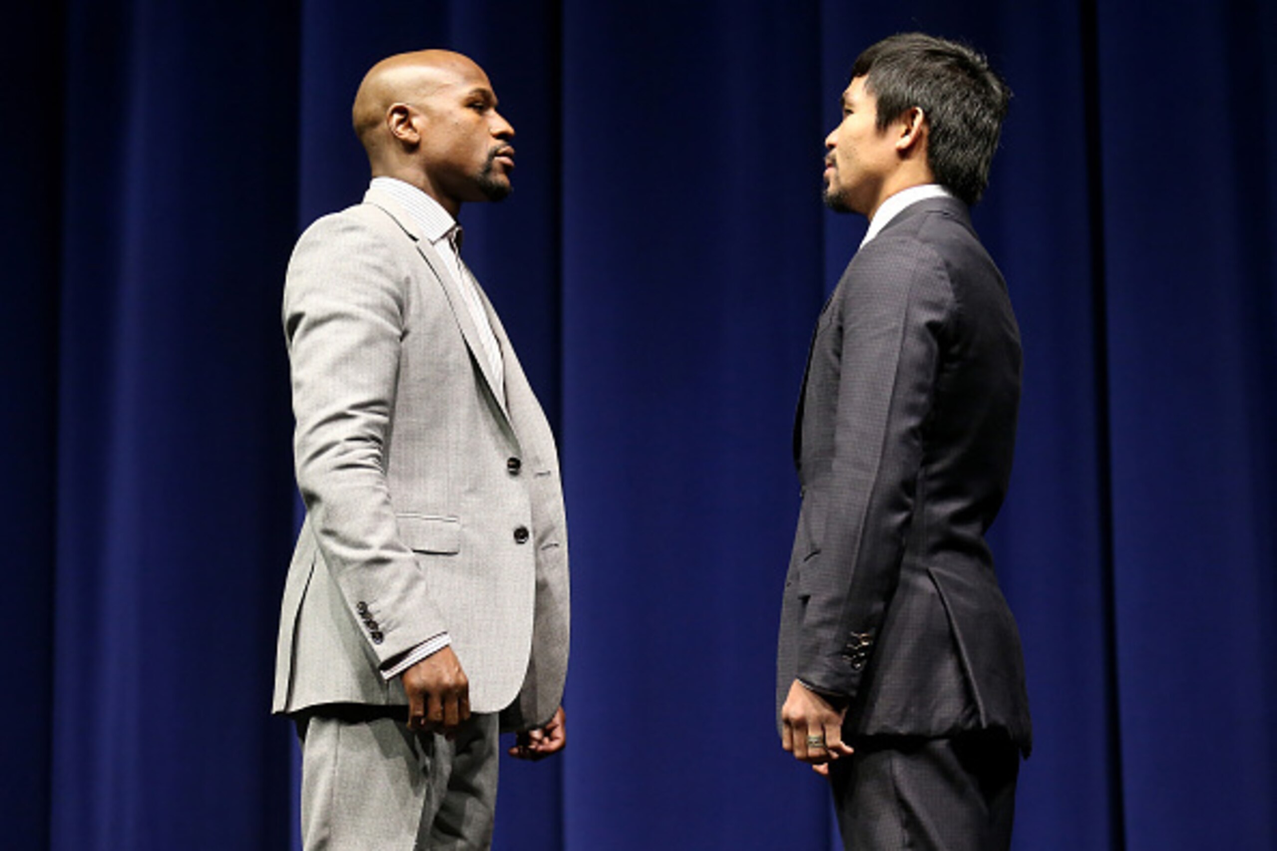LOS ANGELES, CA - MARCH 11: Floyd Mayweather (L) and Manny Pacquiao face off at the start of their Press Conference promoting their upcoming fight on March 11, 2015 in Los Angeles, California. (Photo by Stephen Dunn/Getty Images) LOS ANGELES, CA - MARCH 11: Floyd Mayweather (L) and Manny Pacquiao face off at the start of their Press Conference promoting their upcoming fight on March 11, 2015 in Los Angeles, California. (Photo by Stephen Dunn/Getty Images)