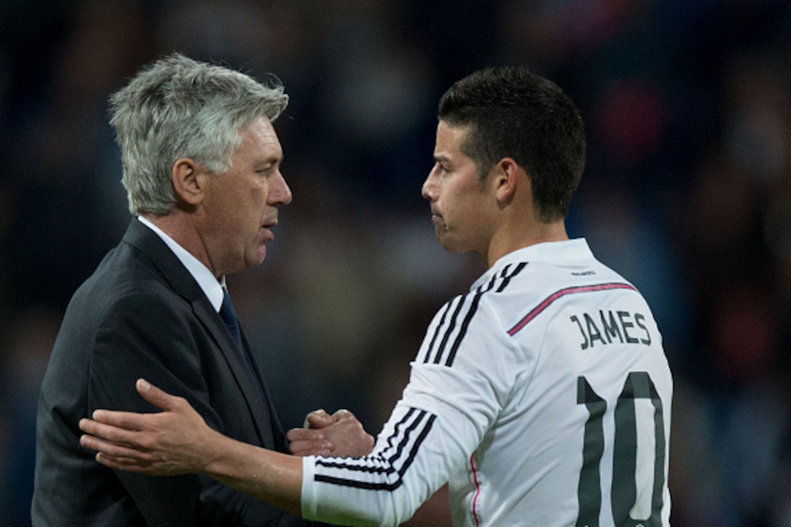 MADRID, SPAIN - APRIL 18: Head coach Carlo Ancelotti (L) of Real Madrid CF shakes hands with his player James Rodriguez (R) after the La Liga match between Real Madrid CF and Malaga CF at Estadio Santiago Bernabeu on April 18, 2015 in Madrid, Spain.  (Pho