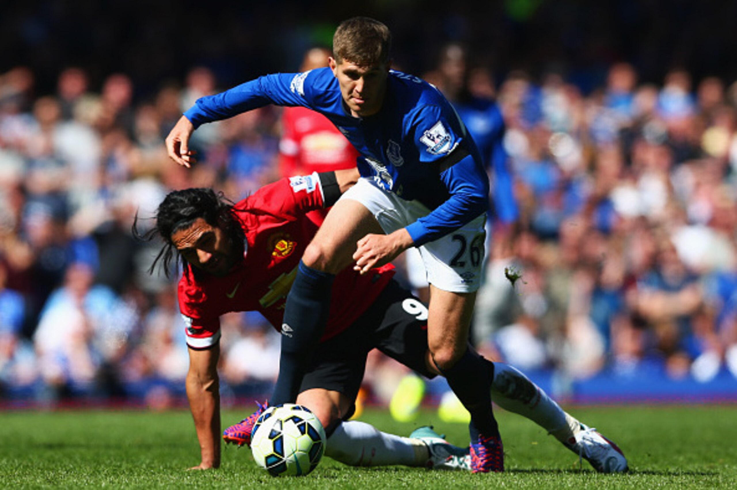 LIVERPOOL, ENGLAND - APRIL 26:  John Stones of Everton battles with Radamel Falcao Garcia of Manchester United during the Barclays Premier League match between Everton and Manchester United at Goodison Park on April 26, 2015 in Liverpool, England.  (Photo