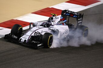 BAHRAIN, BAHRAIN - APRIL 19:  Valtteri Bottas of Finland and Williams locks his brakes during the Bahrain Formula One Grand Prix at Bahrain International Circuit on April 19, 2015 in Bahrain, Bahrain.  (Photo by Clive Mason/Getty Images)