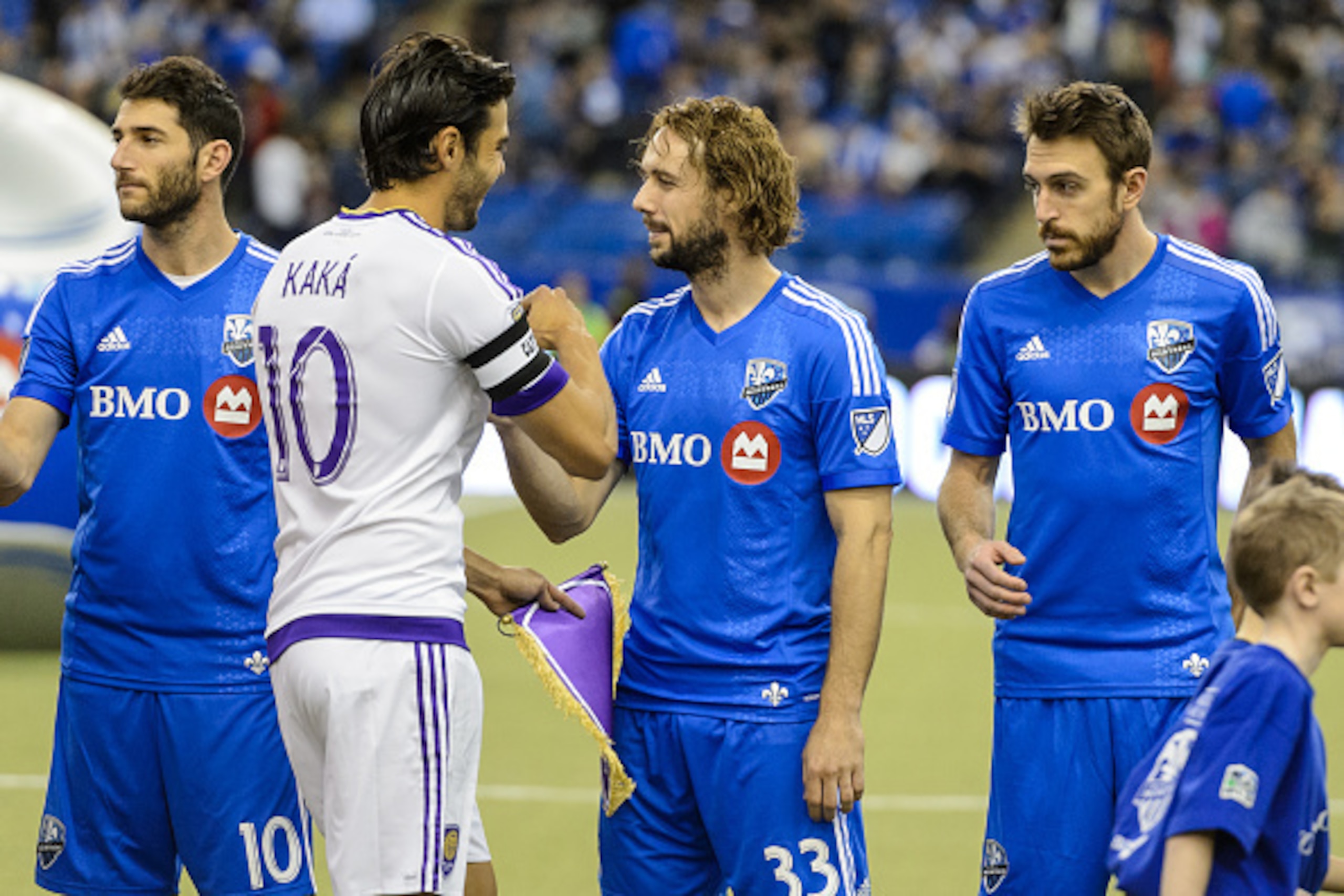 MONTREAL, QC - MARCH 28:  Kaka #10 of Orlando City SC shakes hands with Marco Donadel #33 of Montreal Impact prior to the start of the MLS game at the Olympic Stadium on March 28, 2015 in Montreal, Quebec, Canada.  The game between Orlando City SC and the