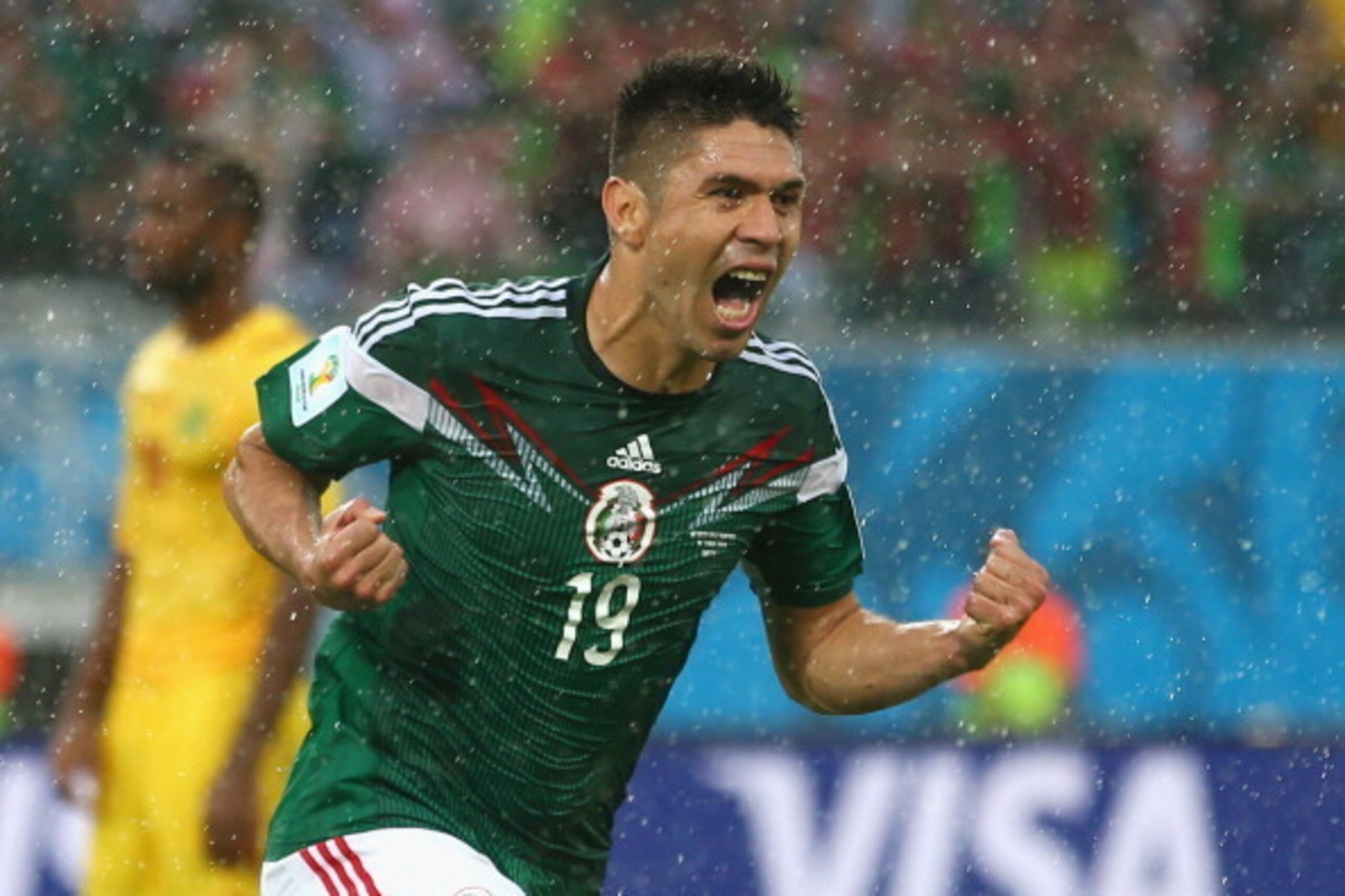 NATAL, BRAZIL - JUNE 13:  Oribe Peralta of Mexico celebrates his goal in the second half during the 2014 FIFA World Cup Brazil Group A match between Mexico and Cameroon at Estadio das Dunas on June 13, 2014 in Natal, Brazil.  (Photo by Julian Finney/Getty