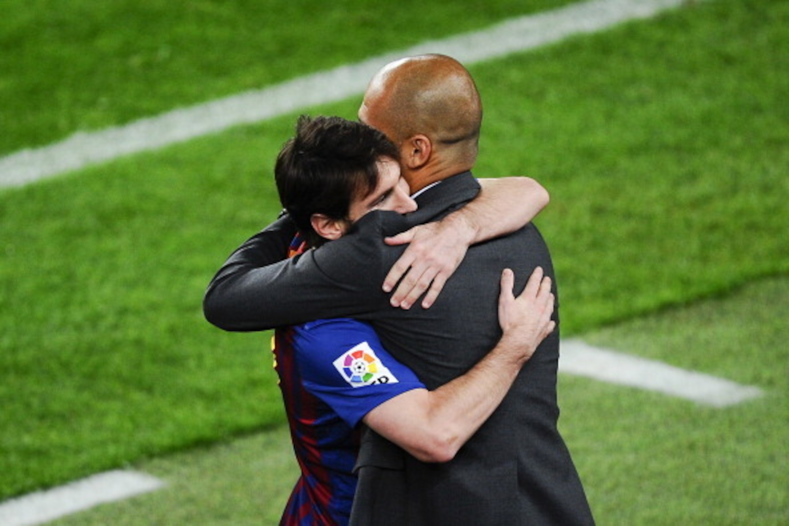 BARCELONA, SPAIN - MAY 05: Lionel Messi of FC Barcelona (R) hugs his Head coach Josep Guardiola of FC Barcelona after scoring his team's third goal during the La Liga match between FC Barcelona and RCD Espanyol at Camp Nou on May 5, 2012 in Barcelona, Sp BARCELONA, SPAIN - MAY 05: Lionel Messi of FC Barcelona (R) hugs his Head coach Josep Guardiola of FC Barcelona after scoring his team's third goal during the La Liga match between FC Barcelona and RCD Espanyol at Camp Nou on May 5, 2012 in Barcelona, Sp