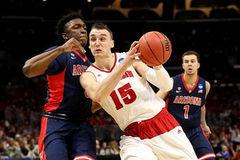 LOS ANGELES, CA - MARCH 28:  Sam Dekker #15 of the Wisconsin Badgers goes up for a shot against Stanley Johnson #5 of the Arizona Wildcats in the first half during the West Regional Final of the 2015 NCAA Men's Basketball Tournament at Staples Center on M