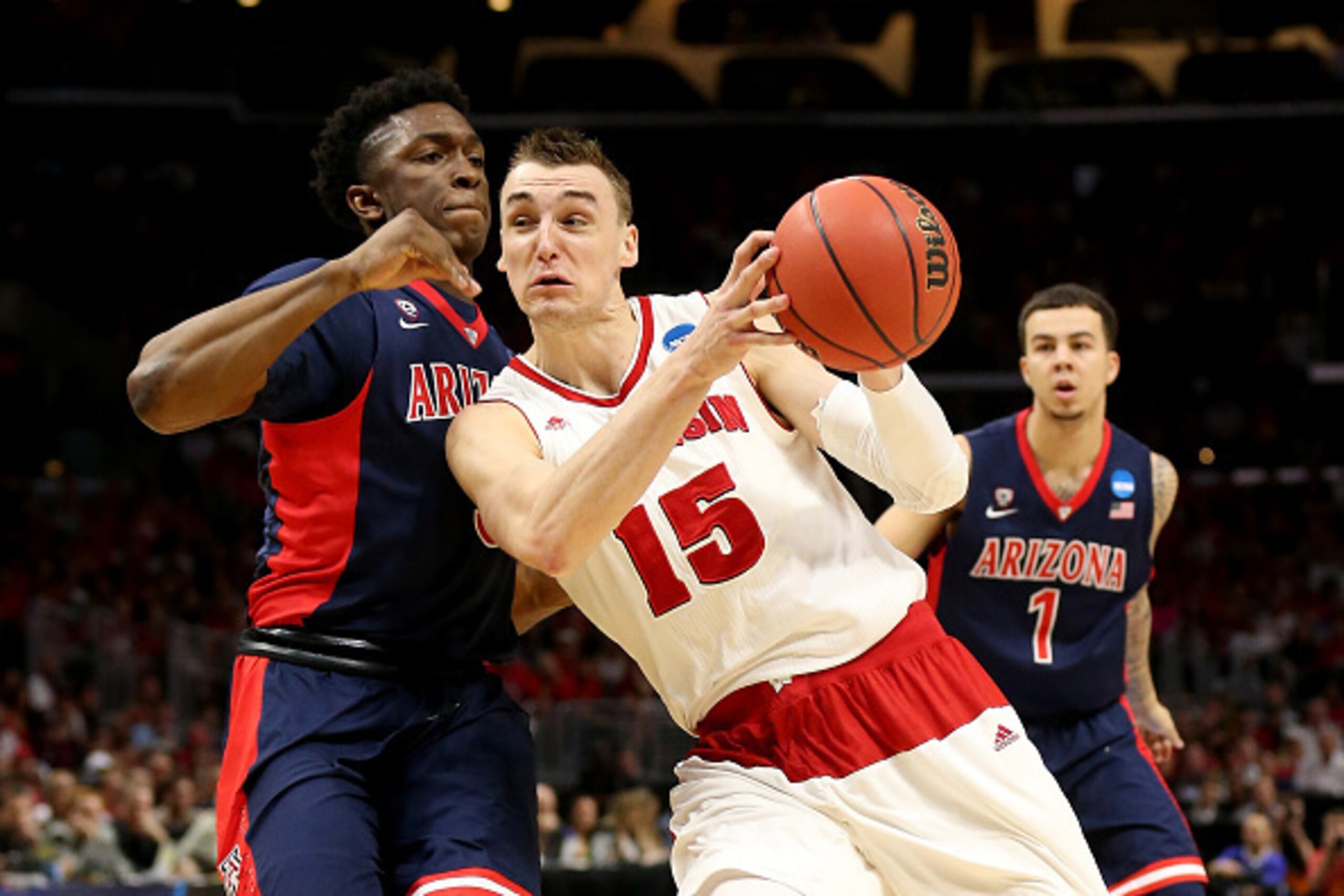 LOS ANGELES, CA - MARCH 28:  Sam Dekker #15 of the Wisconsin Badgers goes up for a shot against Stanley Johnson #5 of the Arizona Wildcats in the first half during the West Regional Final of the 2015 NCAA Men's Basketball Tournament at Staples Center on M