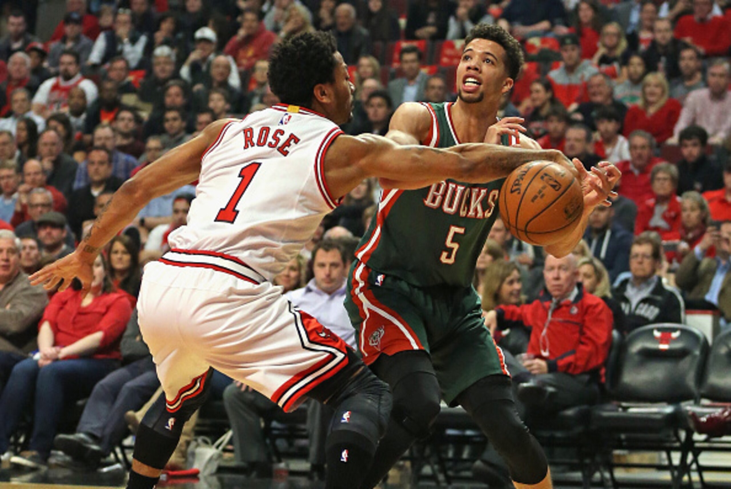 CHICAGO, IL - APRIL 27:  Derrick Rose #1 of the Chicago Bulls knocks the ball away from Michael Carter-Williams #5 of the Milwaukee Bucks during the first round of the 2015 NBA Playoffs at the United Center on April 27, 2015 in Chicago, Illinois. NOTE TO 