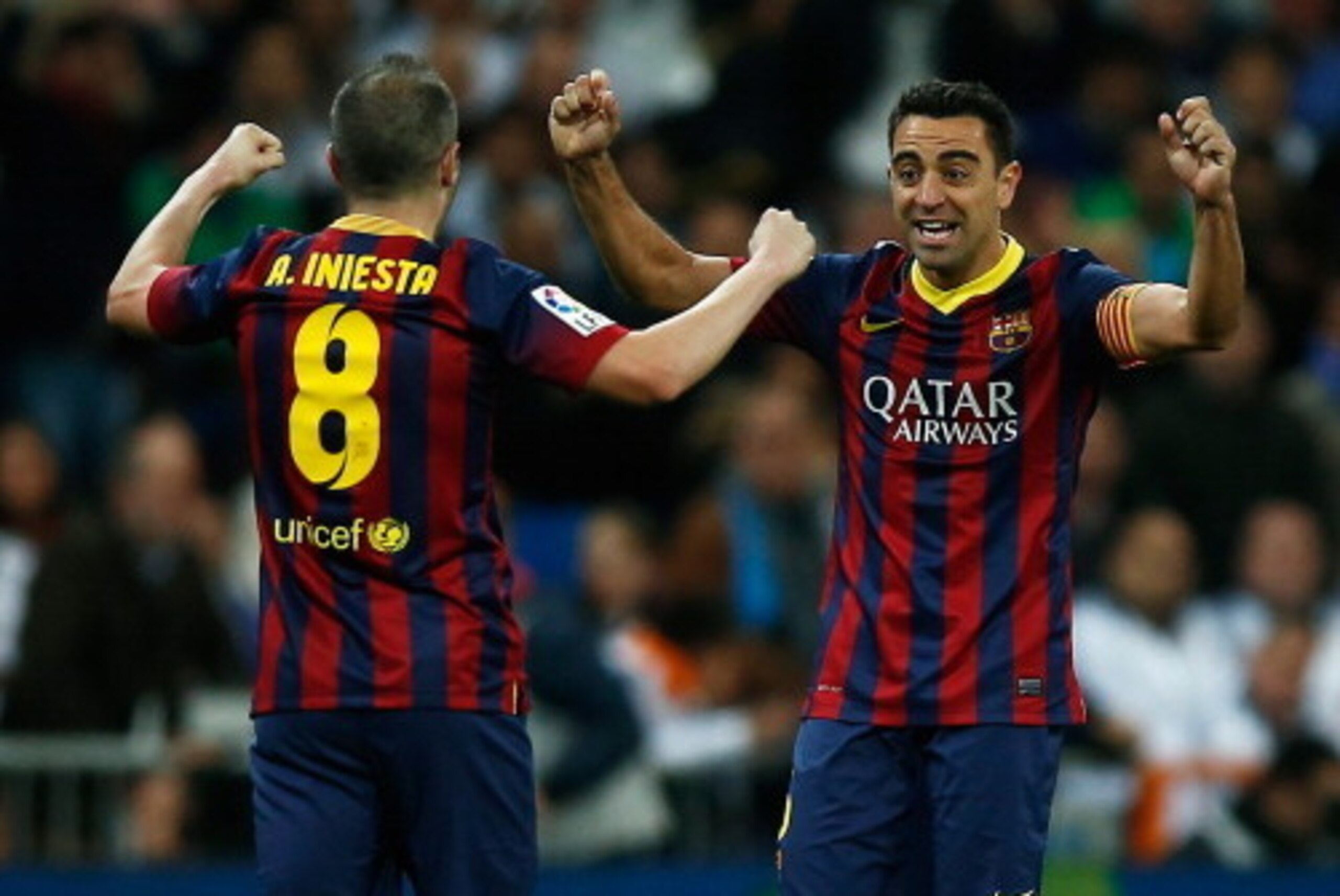 MADRID, SPAIN - MARCH 23: Xavi (R) of Barcelona celebrates victory with Andres Iniesta after the La Liga match between Real Madrid CF and FC Barcelona at the Bernabeu on March 23, 2014 in Madrid, Spain. (Photo by Gonzalo Arroyo Moreno/Getty Images) MADRID, SPAIN - MARCH 23: Xavi (R) of Barcelona celebrates victory with Andres Iniesta after the La Liga match between Real Madrid CF and FC Barcelona at the Bernabeu on March 23, 2014 in Madrid, Spain. (Photo by Gonzalo Arroyo Moreno/Getty Images)