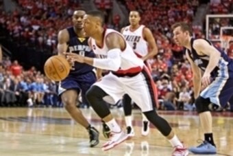 Apr 27, 2015; Portland, OR, USA; Portland Trail Blazers guard Damian Lillard (0) drives past Memphis Grizzlies forward Tony Allen (9) during the second quarter in game four of the first round of the NBA Playoffs at the Moda Center. Mandatory Credit: Craig