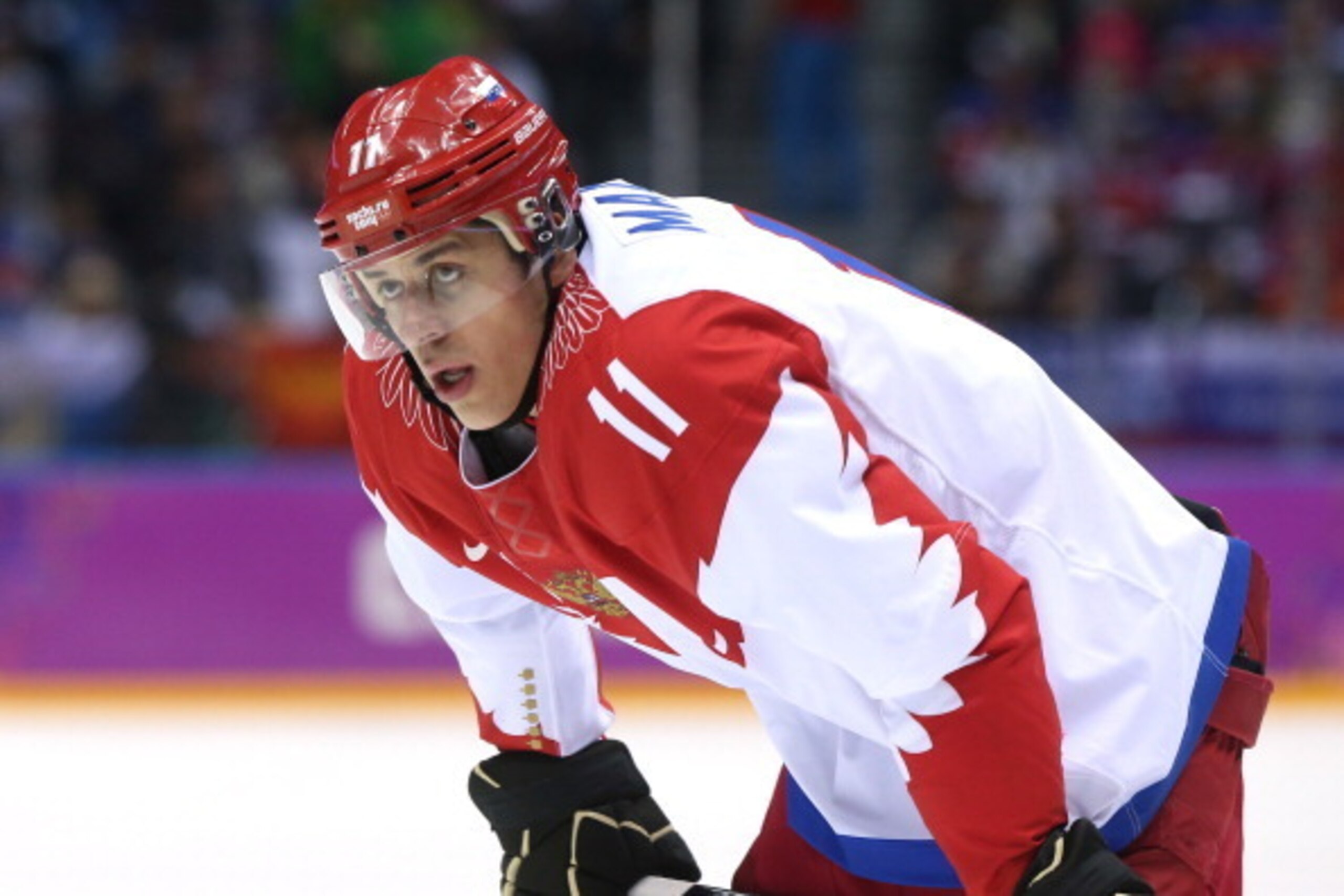 SOCHI, RUSSIA - FEBRUARY 19: Yevgeni Malkin #11 of Russia looks on during the Men's Ice Hockey Quarterfinal Playoff against Finland on Day 12 of the 2014 Sochi Winter Olympics at Bolshoy Ice Dome on February 19, 2014 in Sochi, Russia. (Photo by Bruce Be SOCHI, RUSSIA - FEBRUARY 19: Yevgeni Malkin #11 of Russia looks on during the Men's Ice Hockey Quarterfinal Playoff against Finland on Day 12 of the 2014 Sochi Winter Olympics at Bolshoy Ice Dome on February 19, 2014 in Sochi, Russia. (Photo by Bruce Be