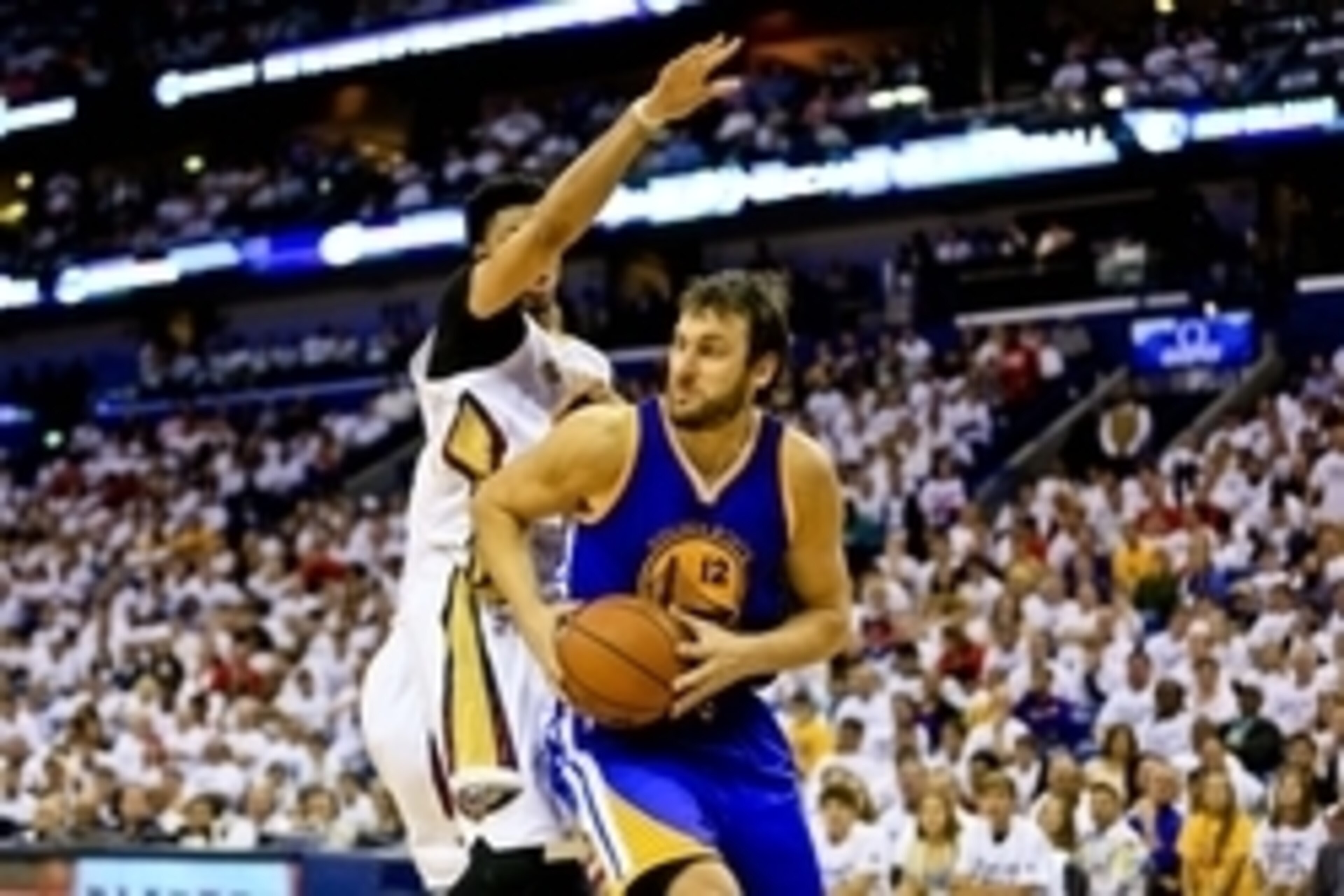 Apr 25, 2015; New Orleans, LA, USA; Golden State Warriors center Andrew Bogut (12) drives past New Orleans Pelicans forward Anthony Davis (23) during the first half in game four of the first round of the NBA Playoffs at the Smoothie King Center. Mandatory